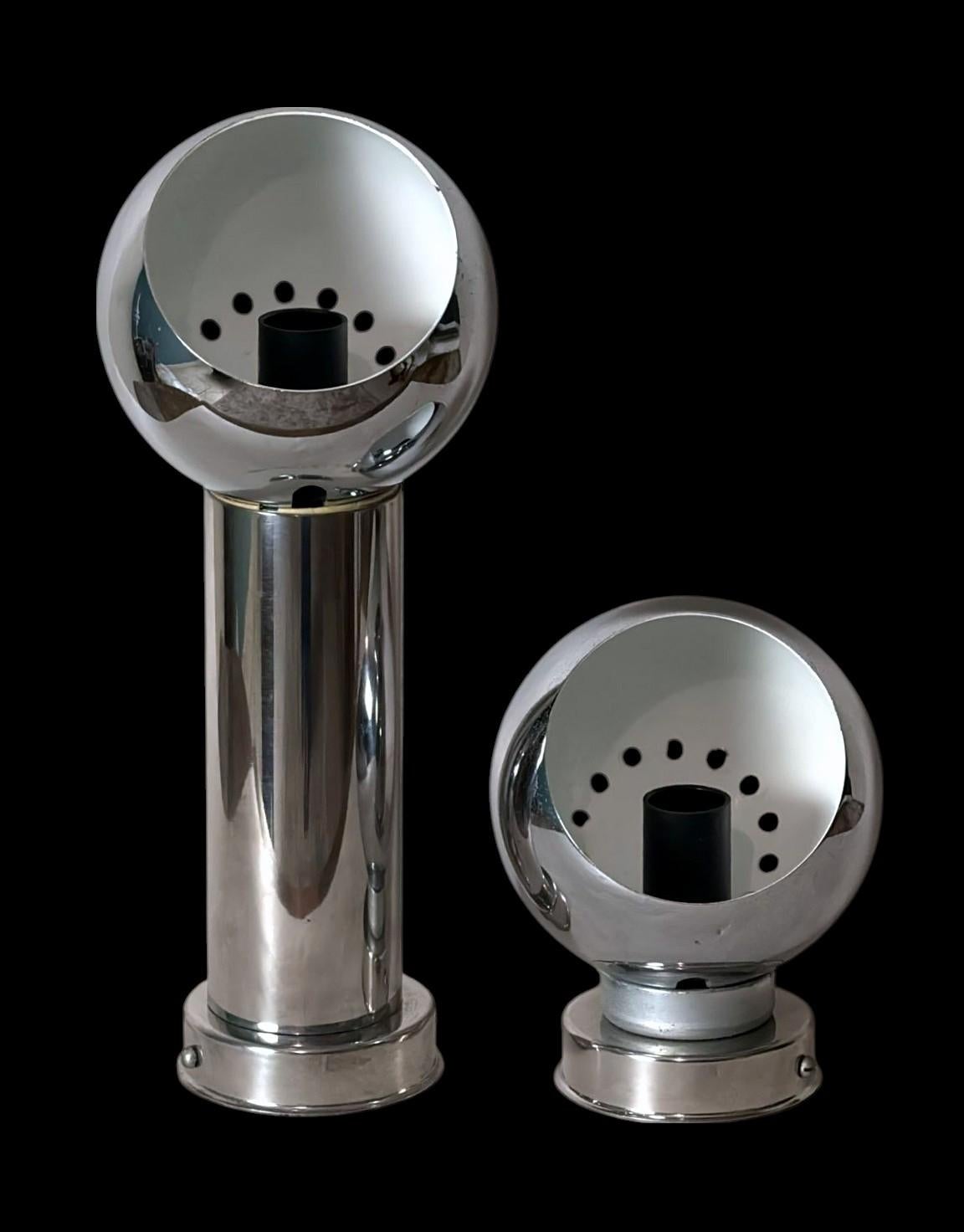 Pair of Italian nickel-plated metal wall sconces in the style of Goffredo Reggiani. Produced in Italy between 1970 and 1975 in a workshop on the outskirts of Milan. Each sconce features a polished spherical diffuser with an angled opening,