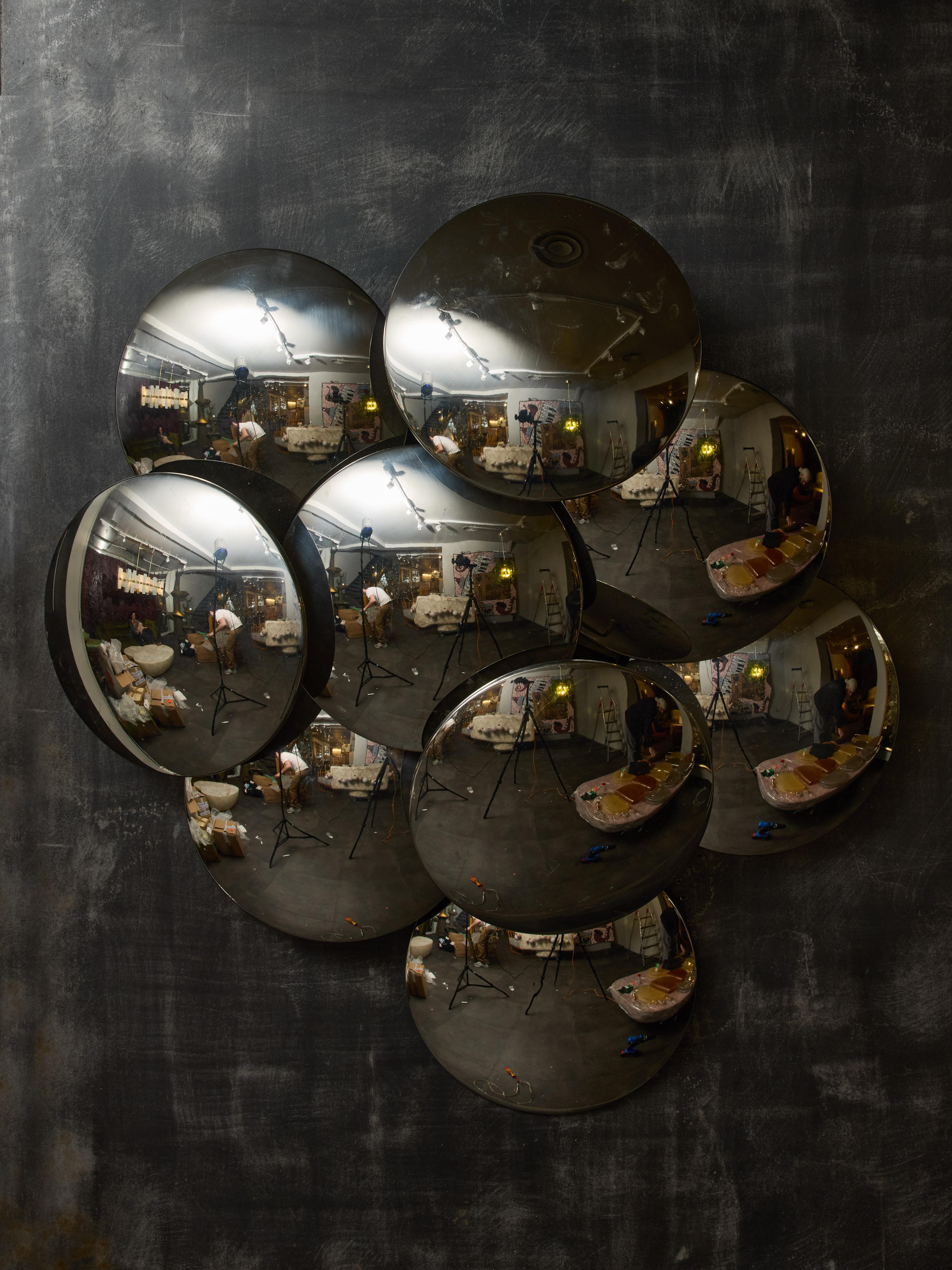Light fixture that can be used as a flush mount or wall sconce, this vintage piece by Reggiani is made of a metal structure covered with overlapping curved metal discs with a polished mirror finish.

Reggiani
Reggiani Illuminazione is a prestigious