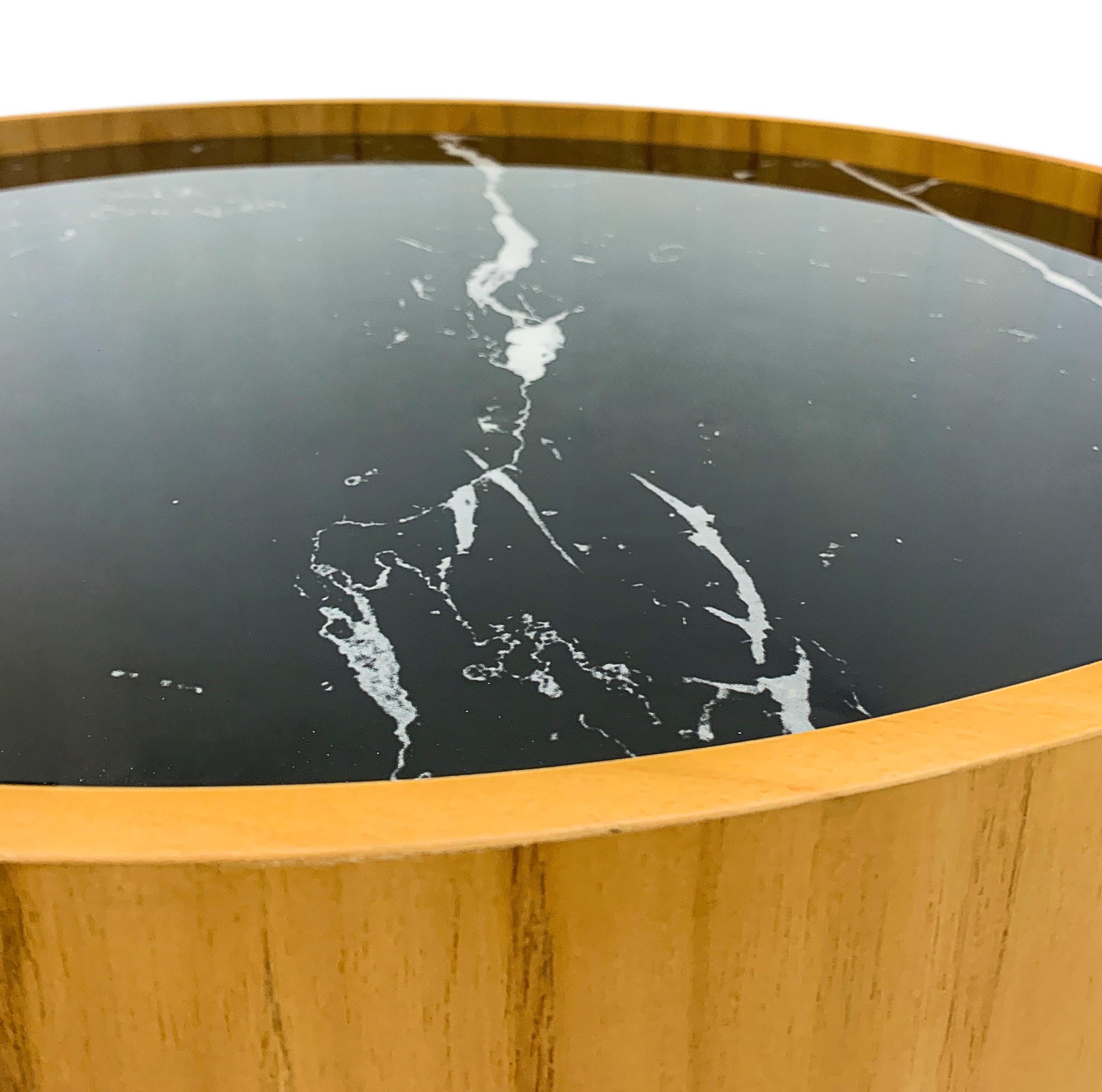 The stunning Regia occasional table consists of a tabletop in black Nero glass that imitates a beautiful black marble with white veins running through it. Combined with a Teak rim and stainless steel legs with a polished finish. The Regia table is