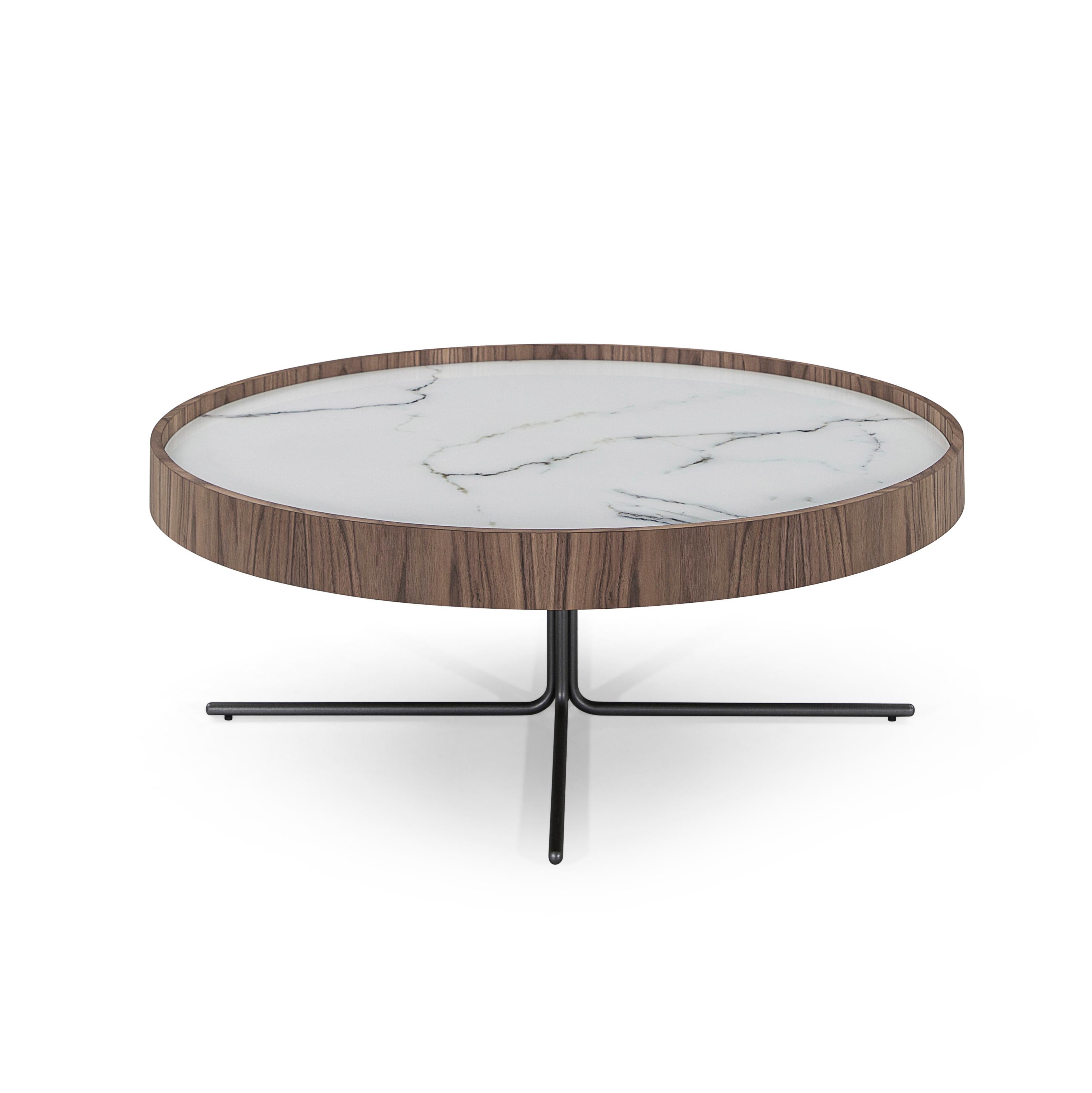 The stunning Regia occasional tables consist of a set of two tables with varying diameters and heights. The tabletop is white glass that imitates a beautiful white marble with black veins running through it. Combined with a walnut rim and stainless