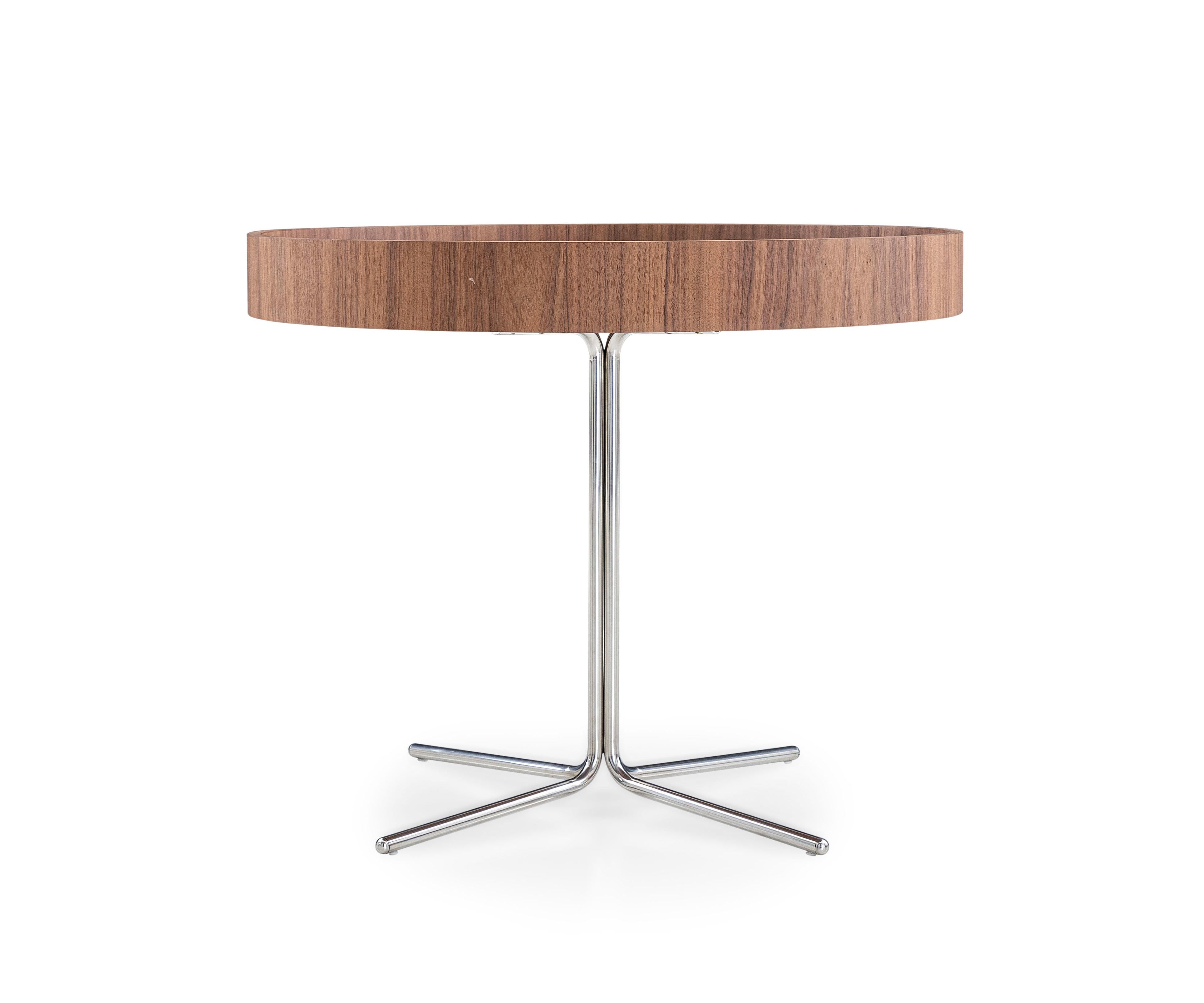 The stunning Regia occasional table consists of a tabletop in brown imperial glass, a walnut rim, and stainless steel legs with a polished finish. The Regia table is yet another minimalist or contemporary fashion statement from Uultis that will help