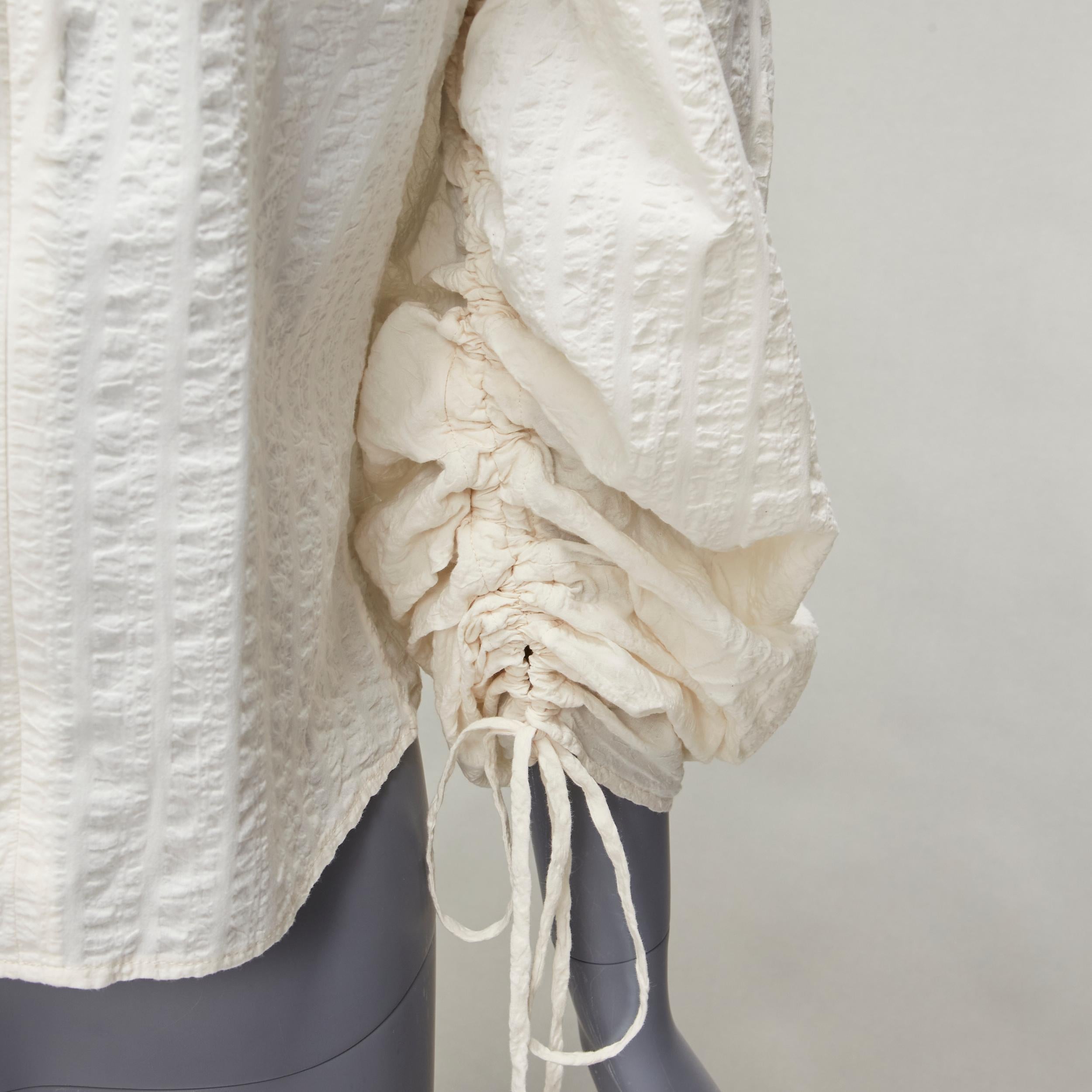 REGINA PYO cream cotton square neck ruched puff sleeves cropped peasant top S
Reference: KYCG/A00005
Brand: Regina Pyo
Material: Cotton
Color: Cream
Pattern: Solid
Closure: Zip
Extra Details: Back zip.
Made in: Korea

CONDITION:
Condition:
