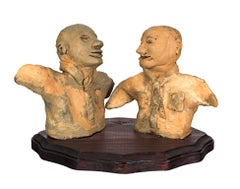 "The Merger Will Have Its Ups & Downs" Clay Sculpture on Wood by Reginald K. Gee