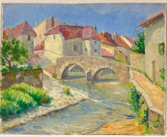 Charming Village with Stone Bridge Over a Flowing River French Countryside