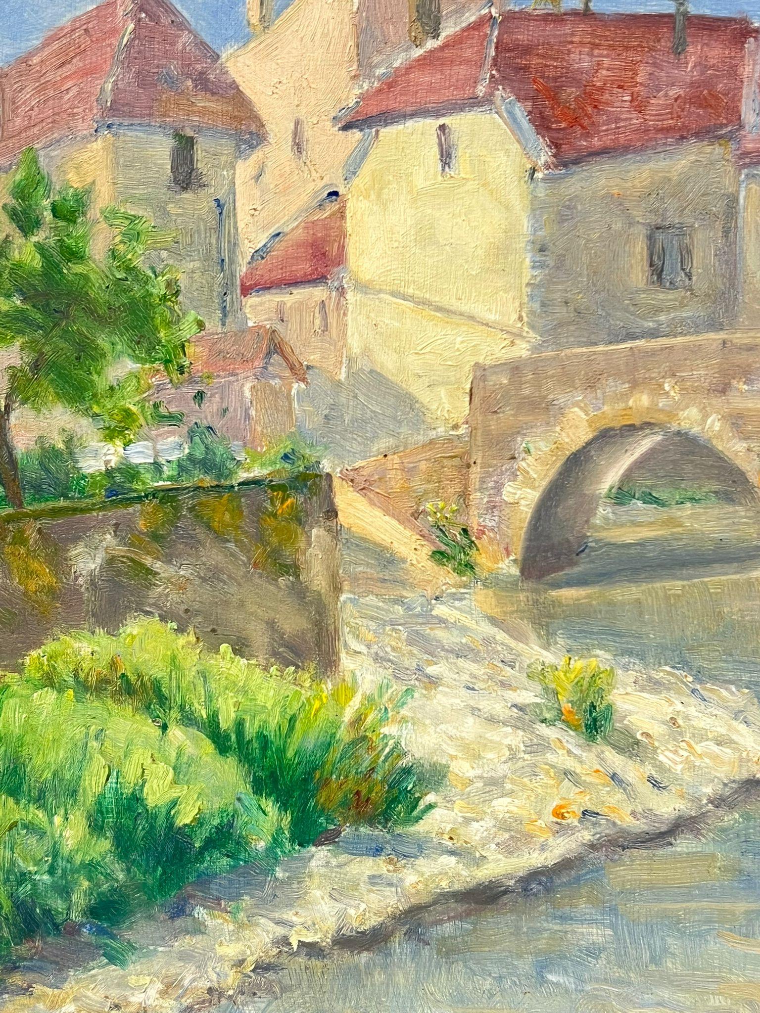 Charming Village with Stone Bridge Over a Flowing River French Countryside - Brown Landscape Painting by Regine David
