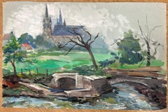 Landscape of a French Countryside with Stone Bridge and Cathedral In Distance