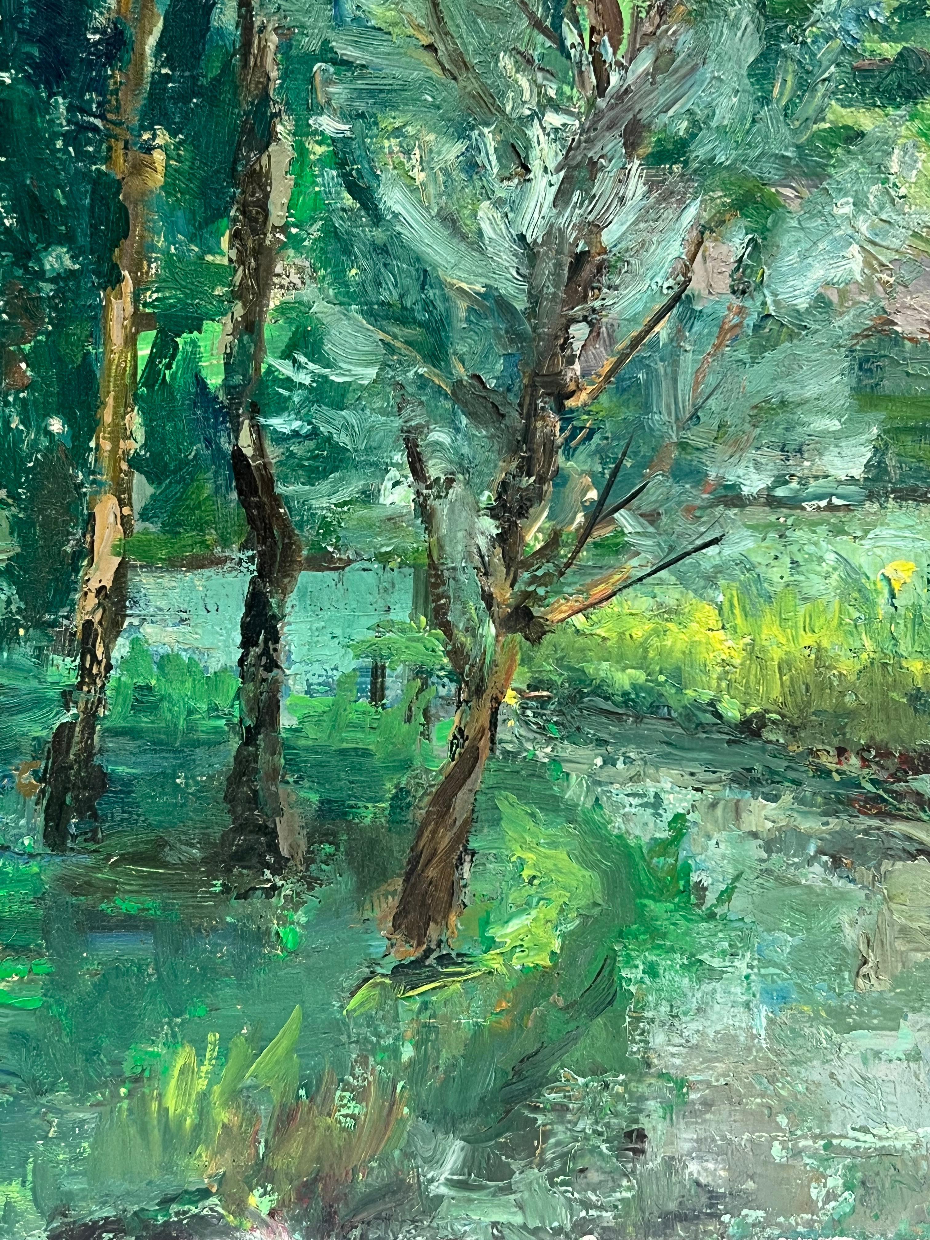 Lush Green Landscape with Tall Trees Framing a Quaint Country House For Sale 1