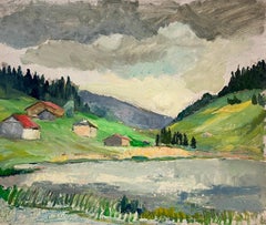Mountain Village by a Reflective Lake Under Moody Skies Landscape