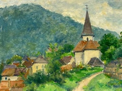 Quaint Village with Church Spire Verdant Hills Peaceful Countryside Setting