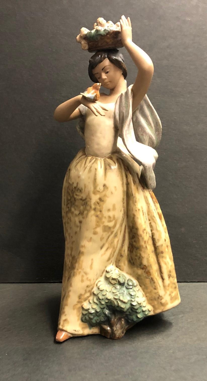 'A Bird on Hand' Lladro Porcelain Figure - Sculpture by Regino Torrijos