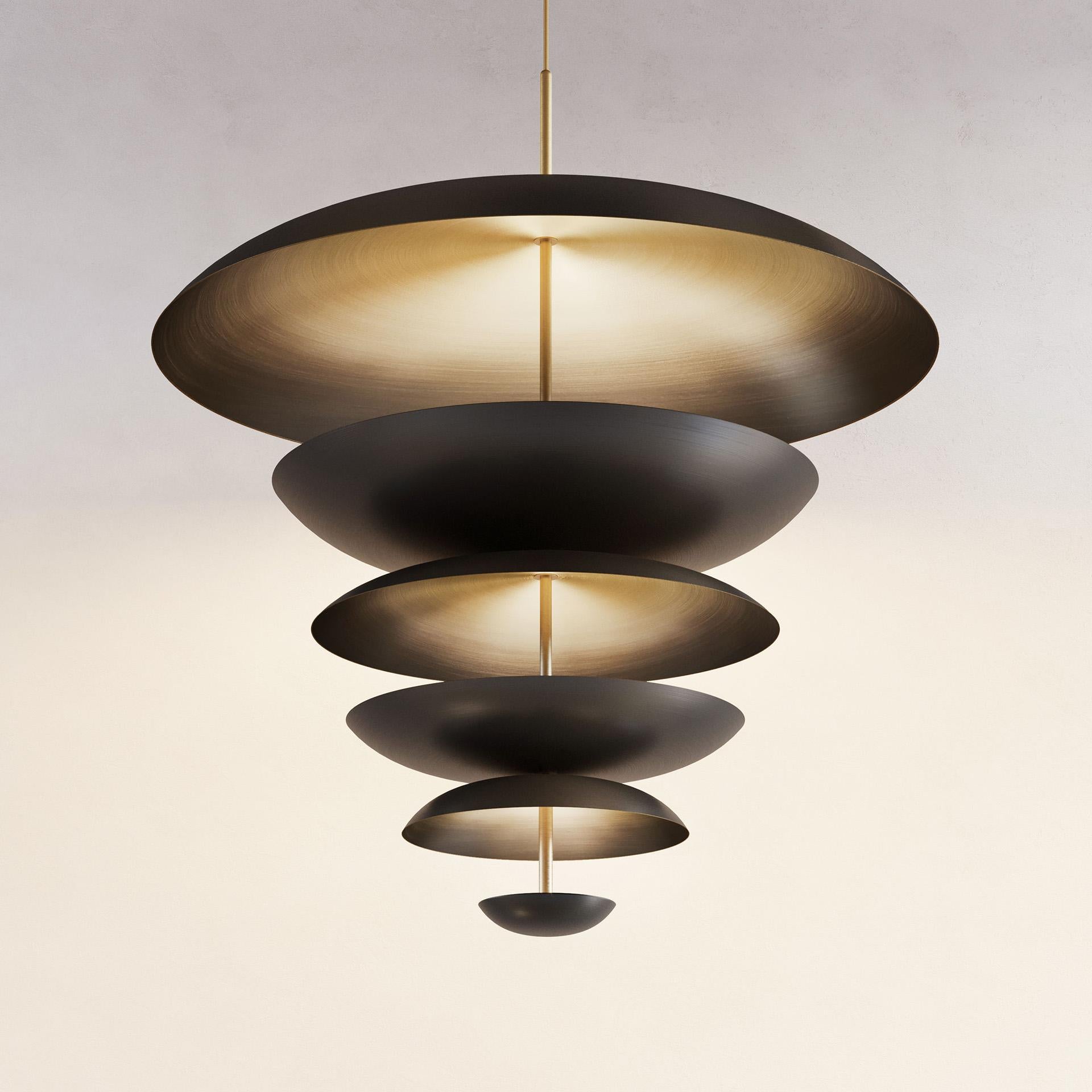 Regolith Chandelier XL 100 by Atelier001
Dimensions: D100 x H108 cm
Materials: Shade Dark bronze patinated brass
Framework Satin brass
Also Available: In different dimension and finishes.

All our lamps can be wired according to each country. If