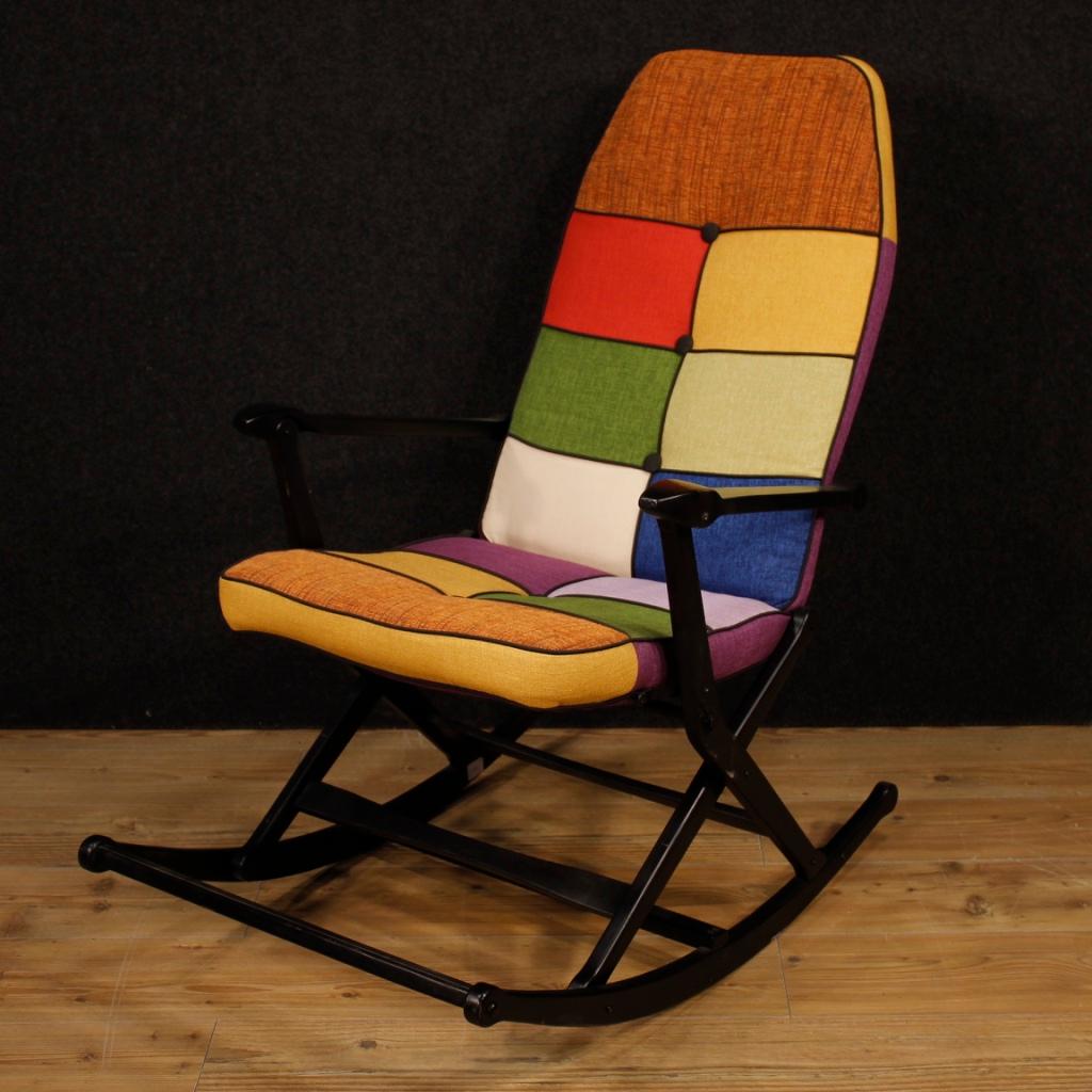 Italian rocking armchair from the 1960s. Lacquered wood furniture with fabric seat and back, not original, in perfect condition (just replaced). Reguitti design armchair, for interior designers and collectors. Foldable furniture to facilitate