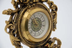 Regulator clock in gilded brass w/ a cut-out shape, mechanical & 36-hour winding