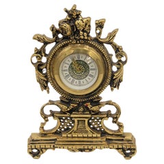 Regulator clock in gilded brass w/ a cut-out shape, mechanical 
36-hour winding