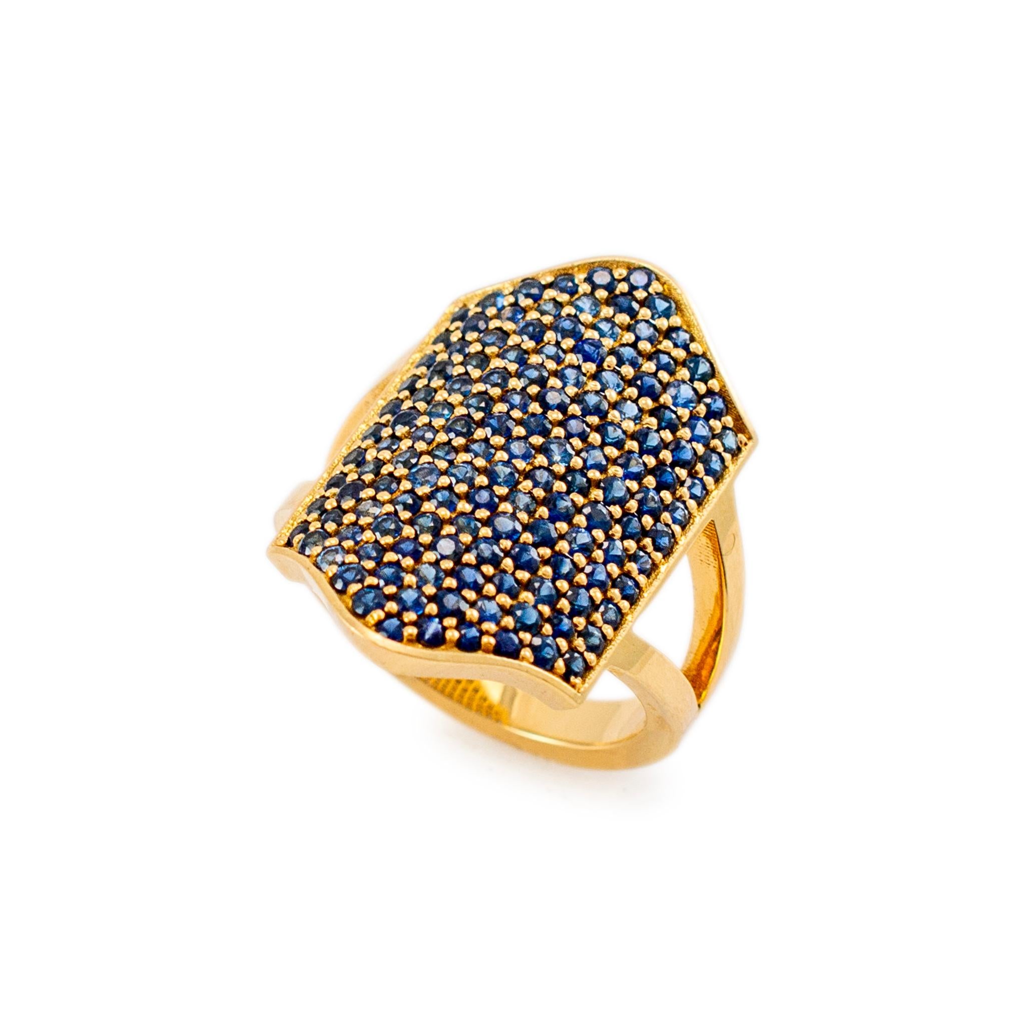 Brand: Reign

Gender: Ladies

Metal Type: 18K Yellow Gold

Ring Size: 7.5

Weight: 11.52 grams

Ladies 18K Yellow Gold sapphire cocktail ring with a split-shank. The metal was tested and determined to be 18K yellow gold. Engraved with 