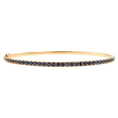 Reign Armreif aus 18 Karat Gelbgold mit Pavé-Saphir