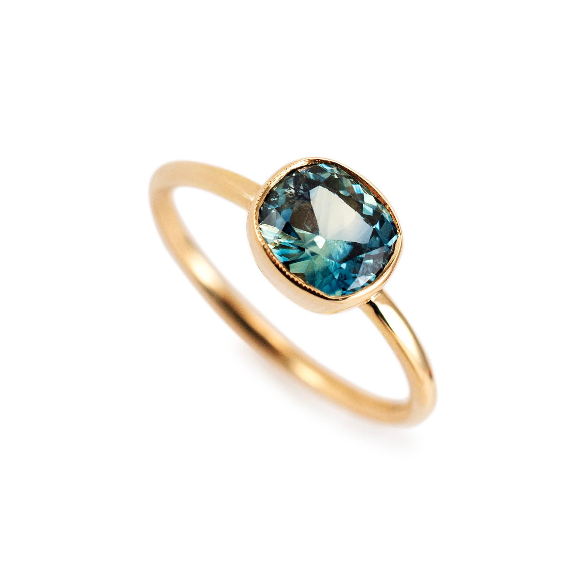 Brand: Reign Sapphires

Gender: Ladies

Metal Type: 18K Yellow Gold

Ring Size: 7.5

Weight: 3.28 grams

One ladies 18K yellow gold sapphire cocktail ring with a half-round shank. The metal was tested and determined to be 18K yellow gold. Engraved
