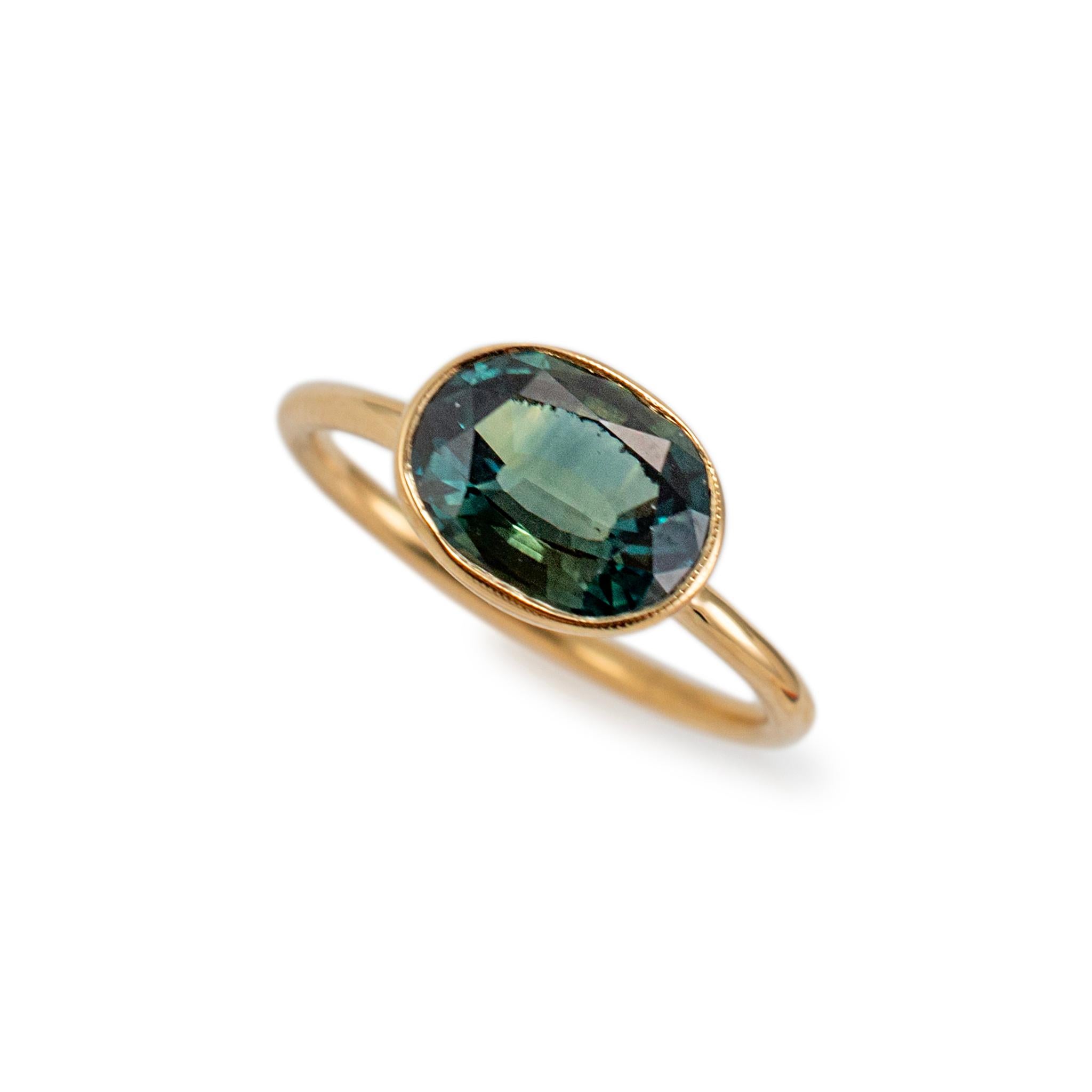 Brand: Reign

Gender: Ladies

Metal Type: 18K Yellow Gold

Ring Size : 7.25

Width: 8.35 mm tapering to 1.60 mm

Weight: 3.63 grams

One ladies designer made polished 18K yellow gold sapphire cocktail ring with a half round shank. The metal was