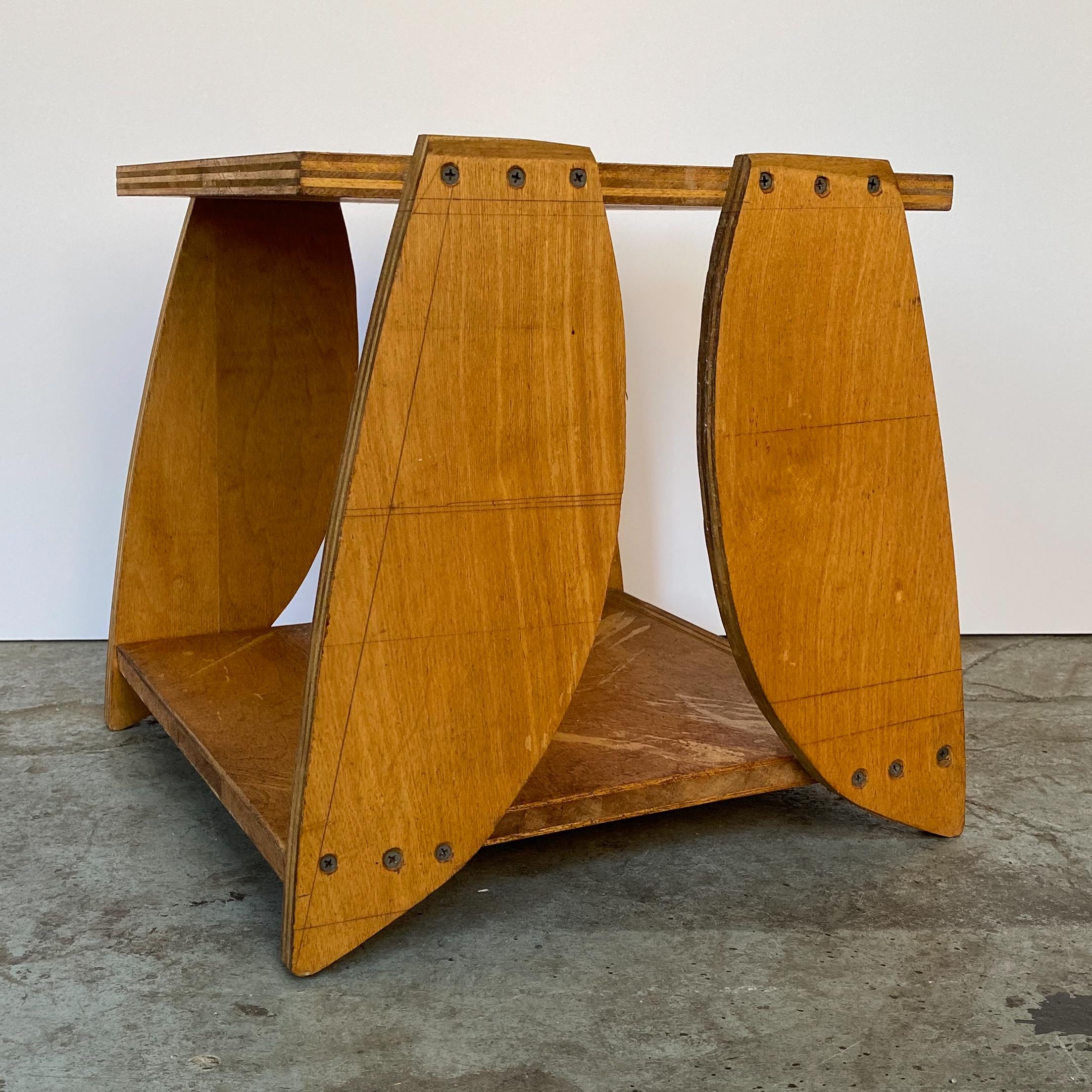 Side table of birch plywood with shaped and cut plywood legs. A home construction project by Japanese or American artist Reiji Kimura, made for his own residence, circa 1970s. Kimura was educated in Japan but moved to New York City in 1956 and was