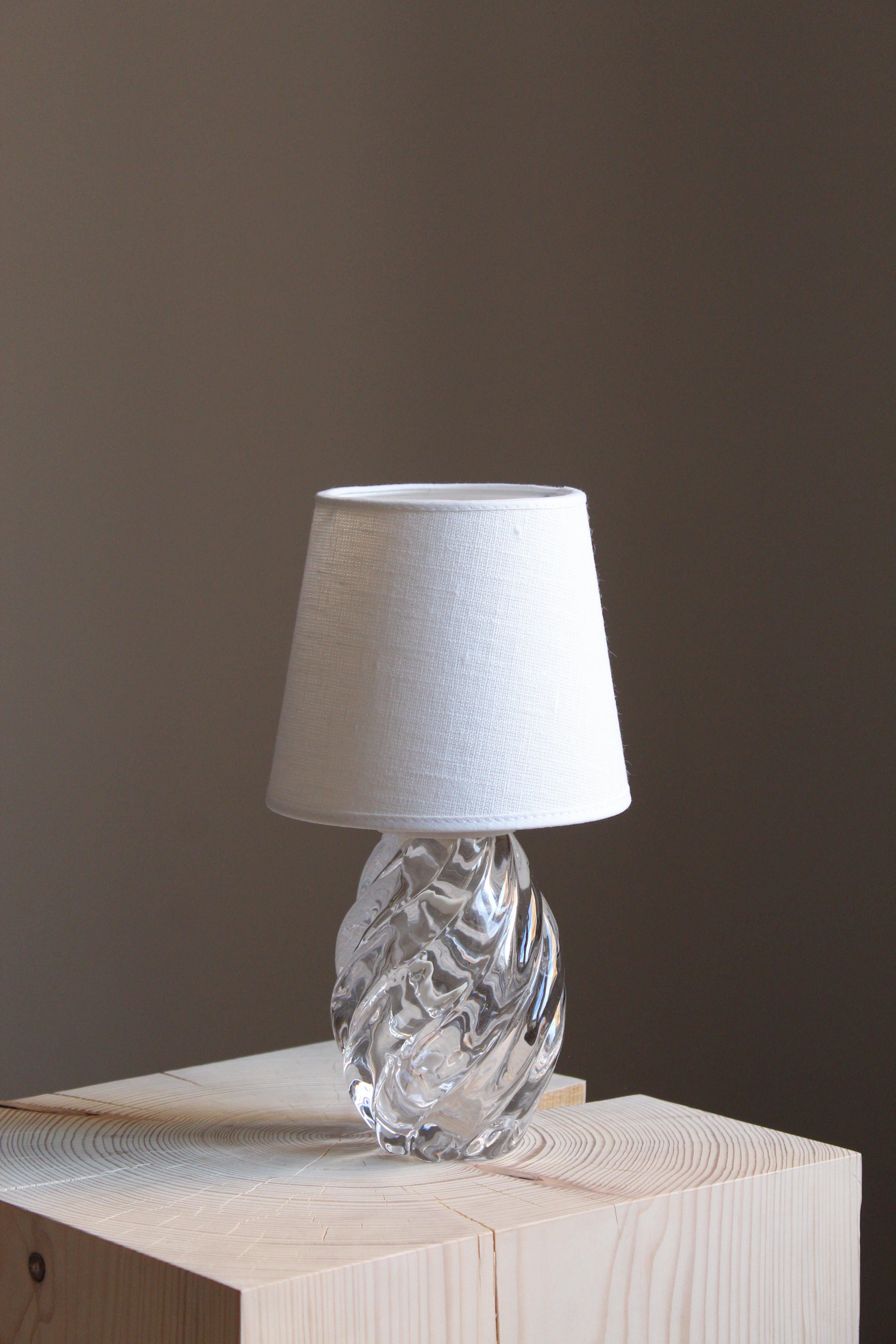 A modernist organic table lamp. Of Swedish production, produced by Reijmyre Glasbruk. In blown glass, 1950s.  Sold without lampshade.

Other designers of the period include Paavo Tynell, Josef Frank, Lisa Johansson-Pape, and Alvar Aalto.