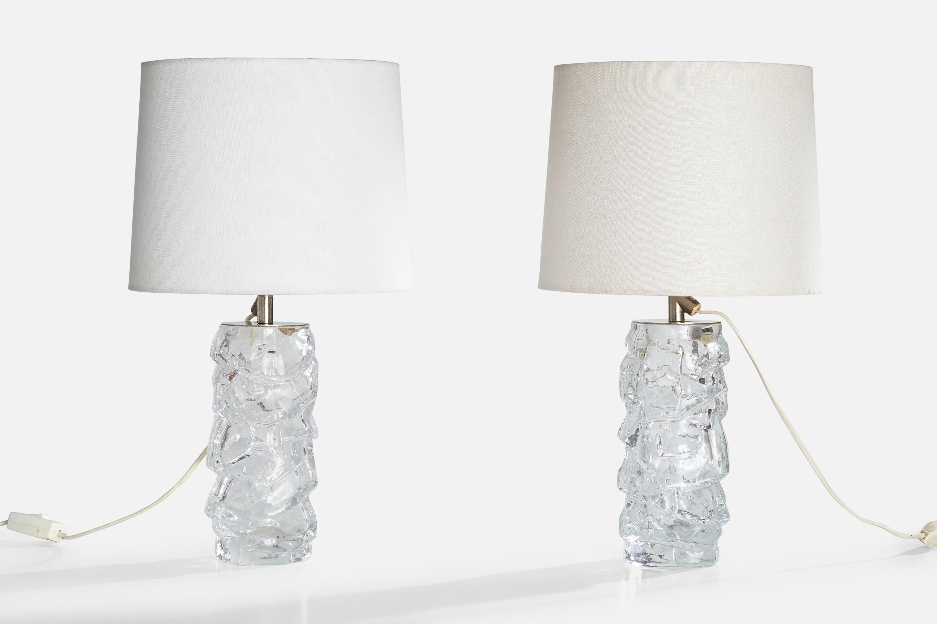 A pair of blown glass and metal table lamps produced by Reijmyre Glasbruk, Sweden, c. 1950s.

Dimensions of Lamp (inches): 11.75”  H x 4“ Diameter

Dimensions of Shade (inches): 9” Top Diameter x 10” Bottom Diameter x 8” H

Dimensions of Lamp with