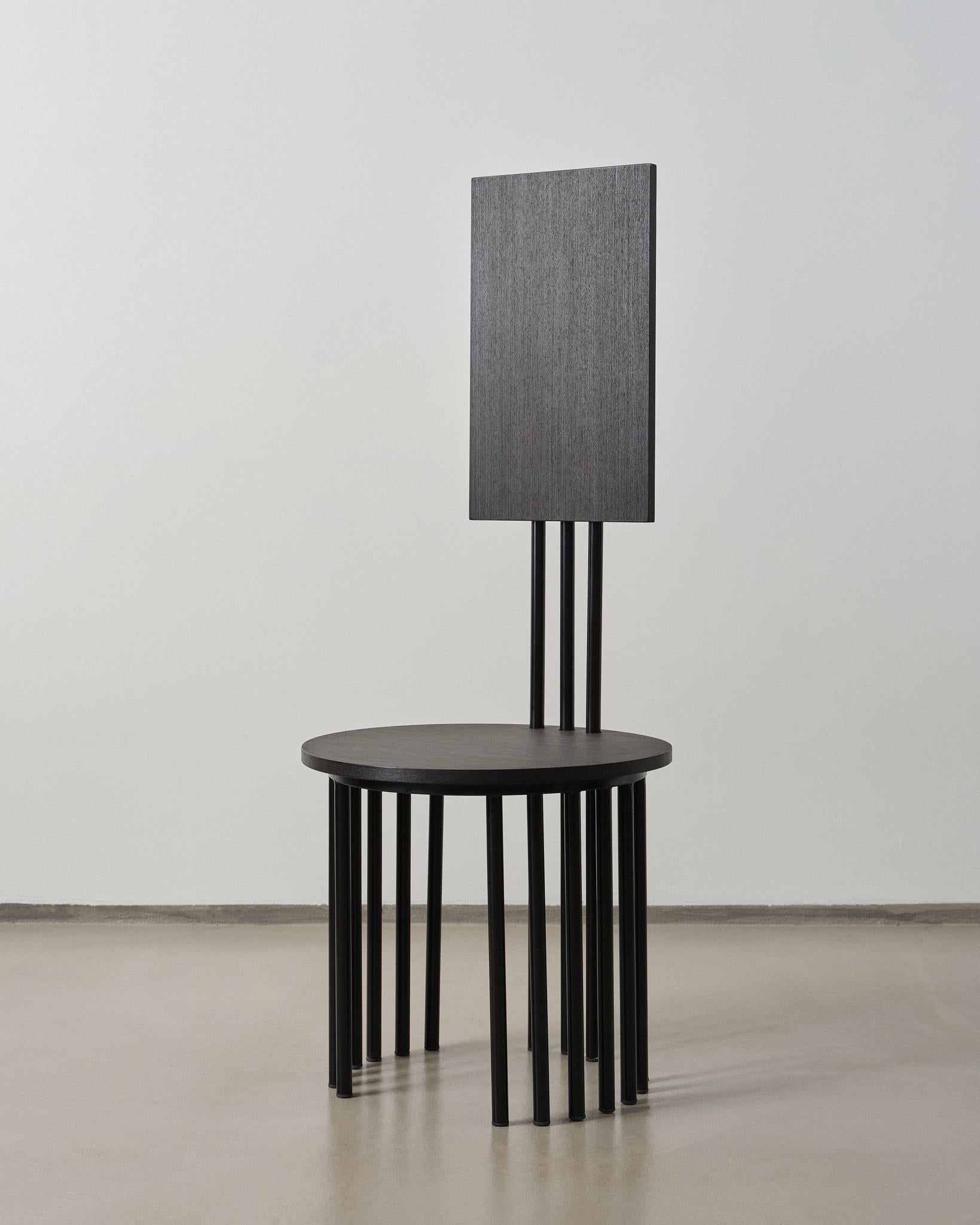 Reina is a sculptural chair that merges artistic expression with functional form. Defined by its towering backrest and rhythmic vertical lines, it commands presence as both a seating form and a statement piece.

A bold expression of symmetry,