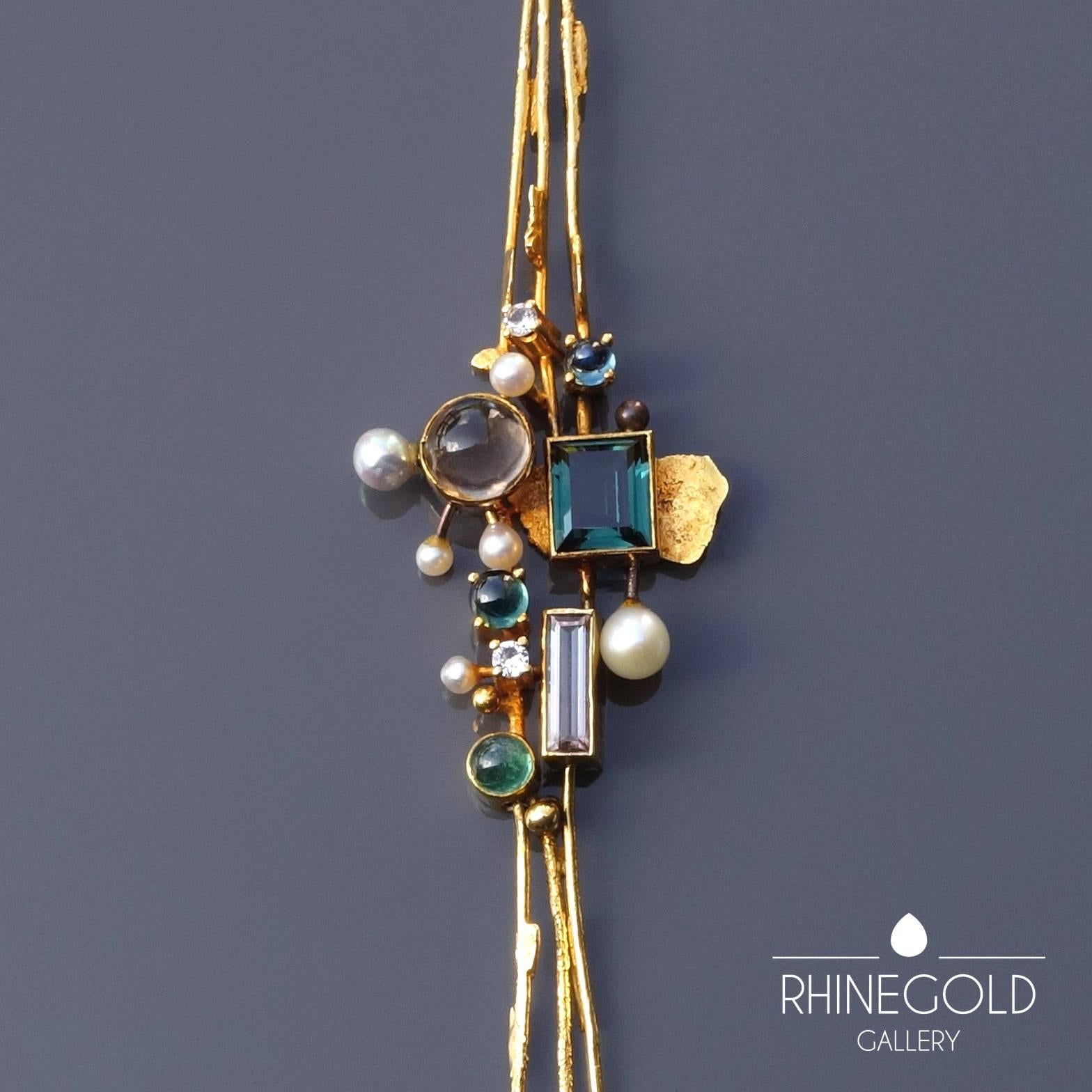 Reinhold Reiling Modernist Emerald Sapphire Tourmaline Quartz Pearl Gold Necklace
18k yellow gold, various precious stones (emerald, quartz, sapphire, tourmaline), pearls
Length of pendant 15.3 cm (approx. 6