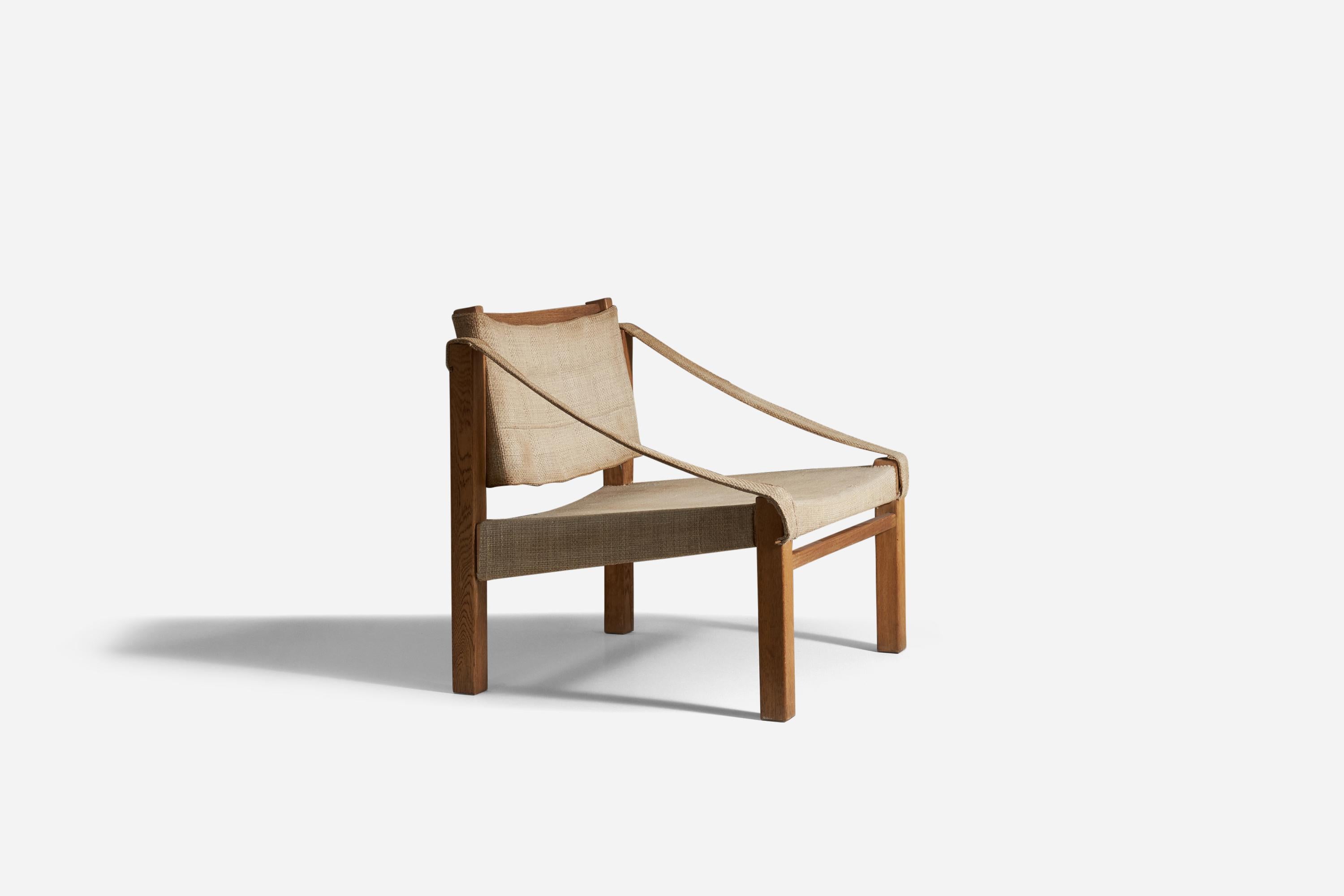 A canvas and oak, adjustable lounge chair designed and produced by Reino Ruokolainen for Villa Juhki, Haimi, Finland, 1950s. 


