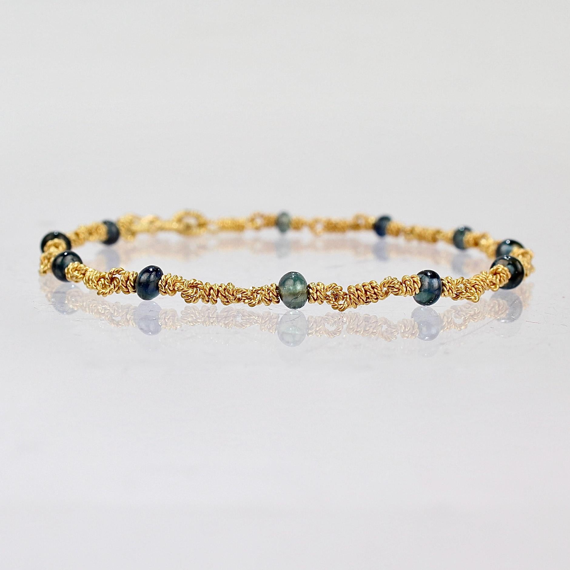A very fine high karat gold bracelet by Reinstein Ross.

With twisted 22 karat gold wire links that are interspersed with sapphire beads.

Date:
20th Century

Overall Condition:
It is in overall good, as-pictured, used estate condition with some