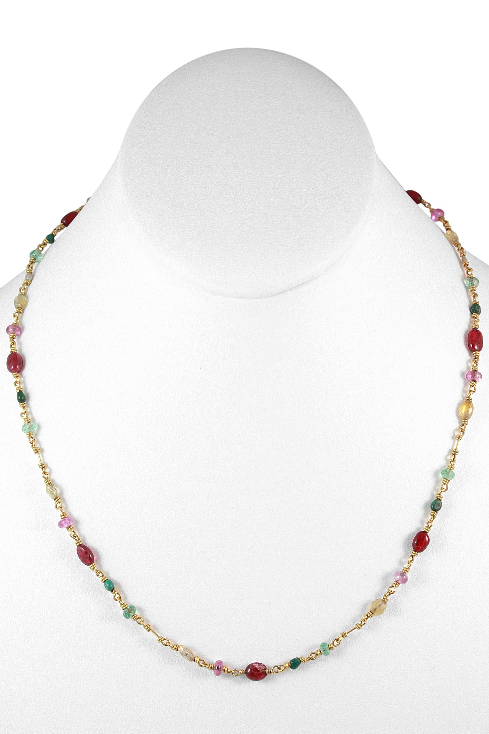 'Isabella' Necklace by Reinstein Ross 
20K Gold with Ruby and Emerald cabochons, seed pearls, as well as faceted pink, green and yellow Tourmalines. 
Signature curved hook closure. 
20