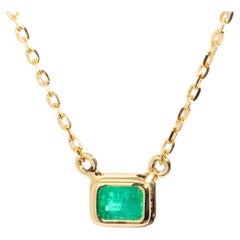 Reinvented 18 Carat Yellow Gold Rubover Emerald Cut Emerald Pendant & Fine Chain