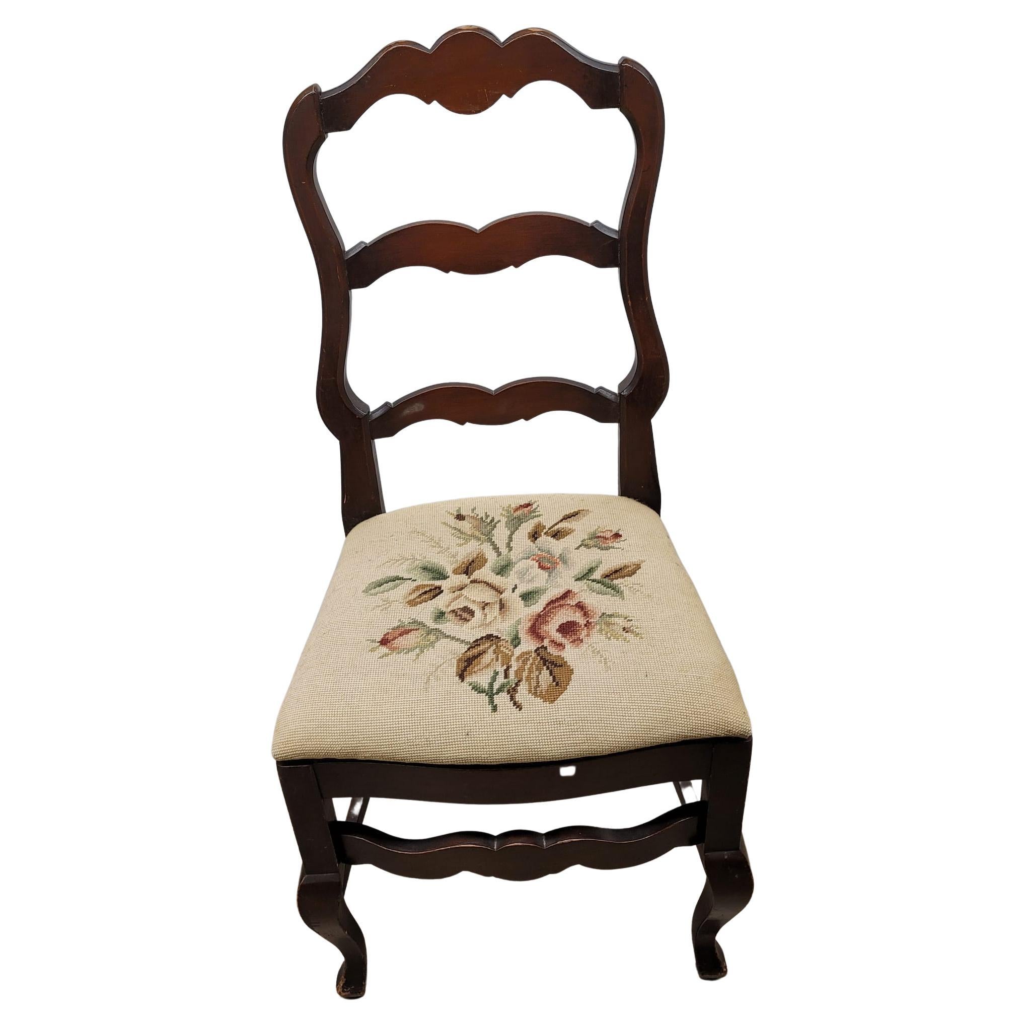 Recently needlepoint reupholstered ladder back mahogany side chair by the Reichenbach Furniture Company. Good vintage condition. Measures 19.5
