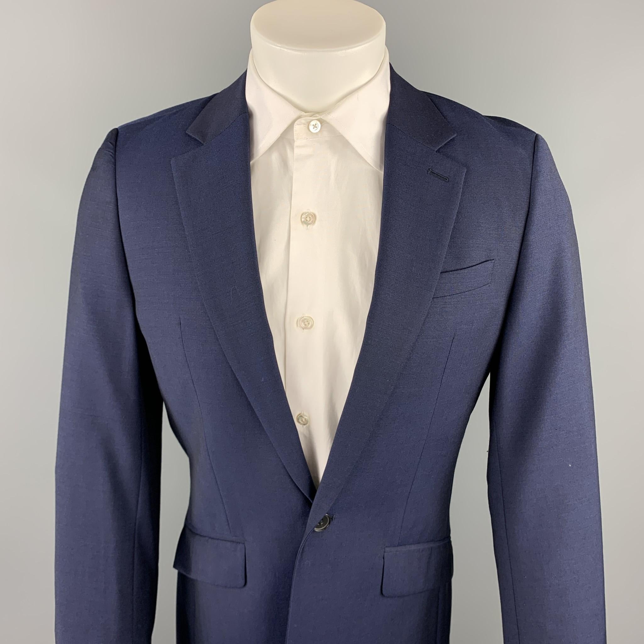 REISS suit comes in a navy wool with a full liner and includes a single breasted, single button sport coat with a notch lapel and matching flat front trousers. 

Excellent Pre-Owned Condition.
Marked: 36

Measurements:

-Jacket
Shoulder: 17