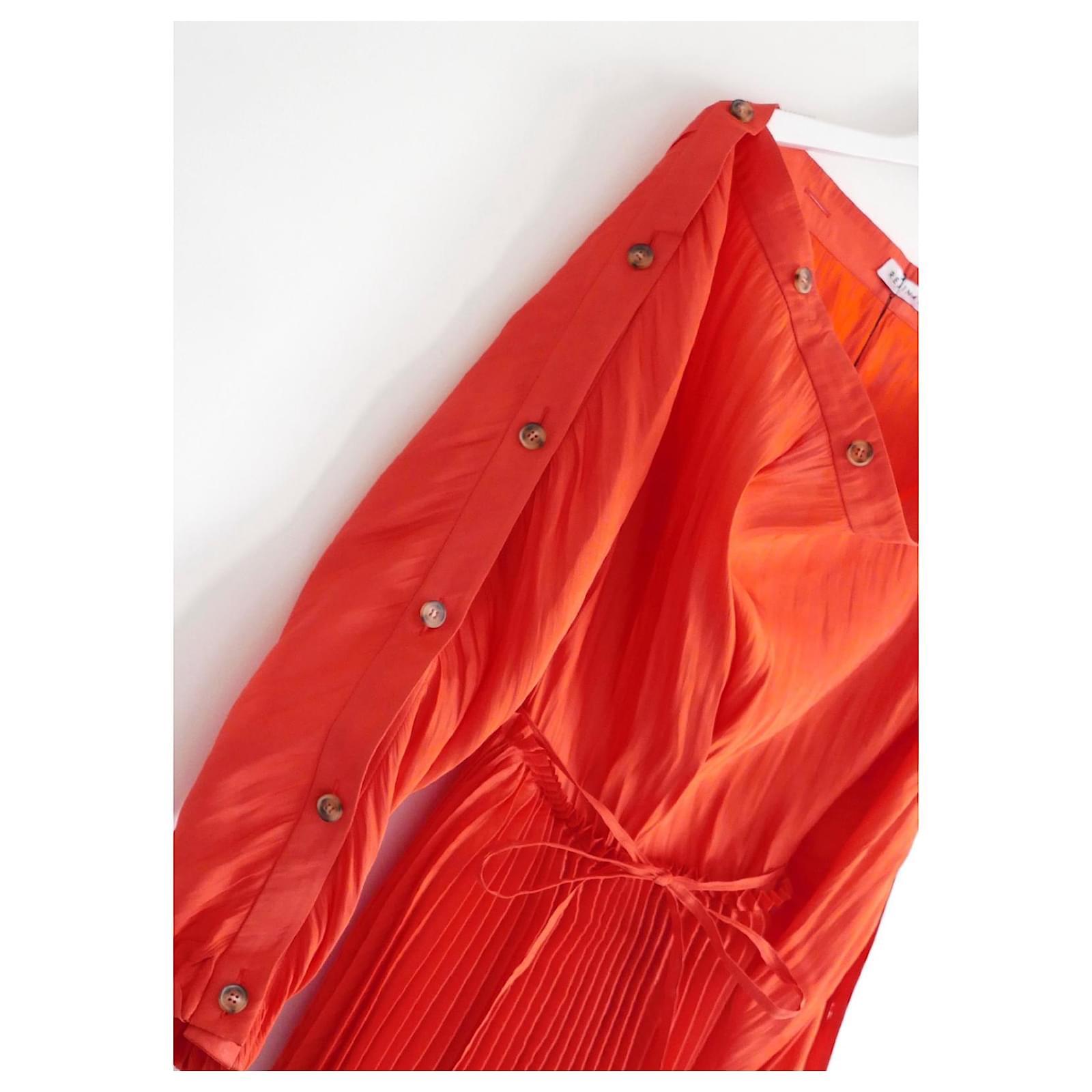 Gorgeous Rejina Pyo Elise dress. Bought for £595 and new with tag. Made from glossy, crinkle texture orangey red polyester, it has a calf length pleated skirt, optional narrow tie belt, buttoned boat neck and buttoned sleeves which can be worn open