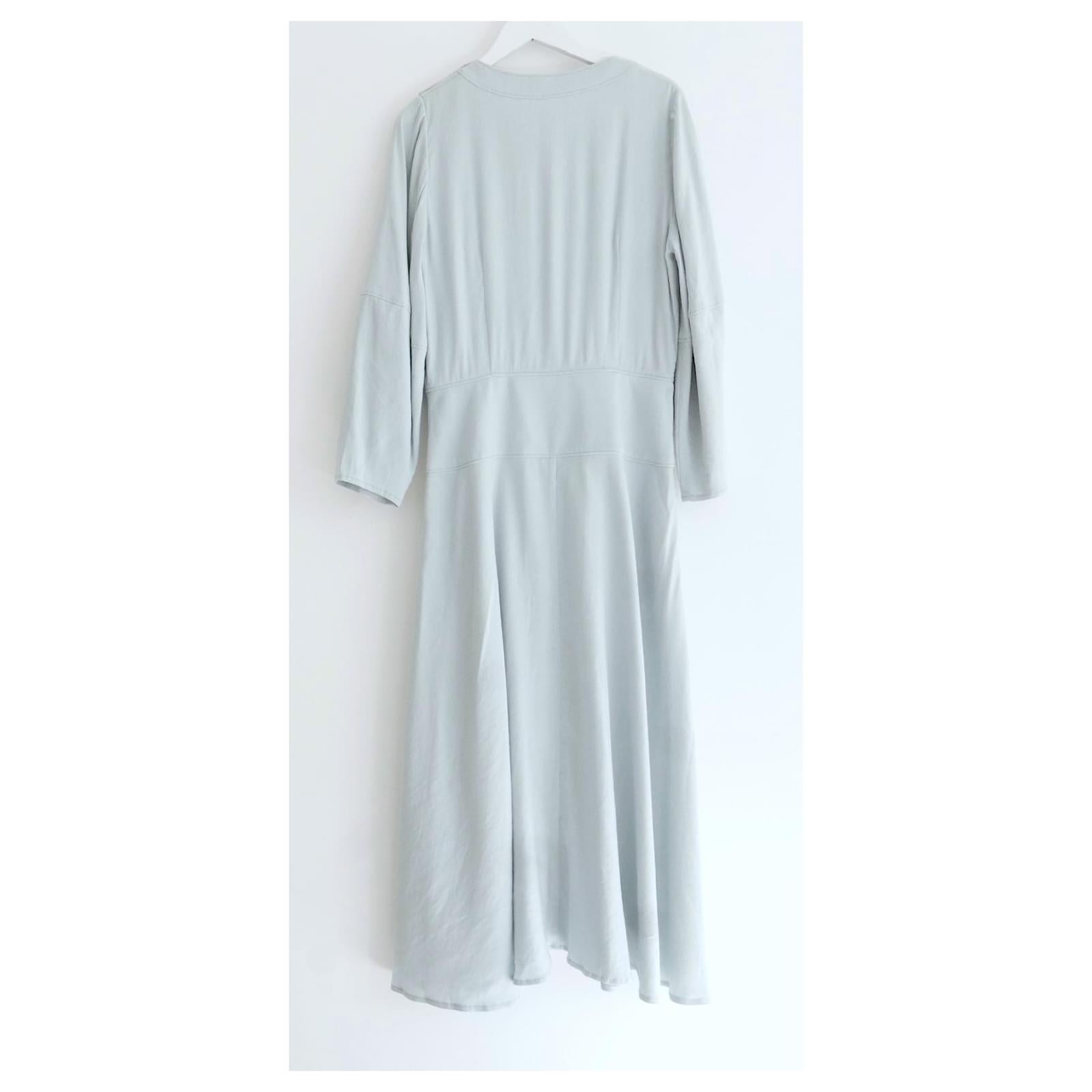Modern feminine Rejina Pyo Michaela midi dress. Bought for £750 and worn once. 
Made from pale sea foam green linen mix chambray. It has a super flattering cut with chunky buttons to front, 
small breast pocket and flared skirt. Size UK10/fr38.