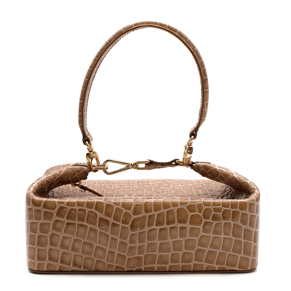 Rejina Pyo Nude Croc Embossed Patent Leather Olivia Bag

- Made of shiny Crocodile embossed leather 
- Detachable single leather top handle
- Top zip closure
- Boxy style 
- Neutral nude hue
- Gold tone hardware 
- Original dust bag 
- Elegant