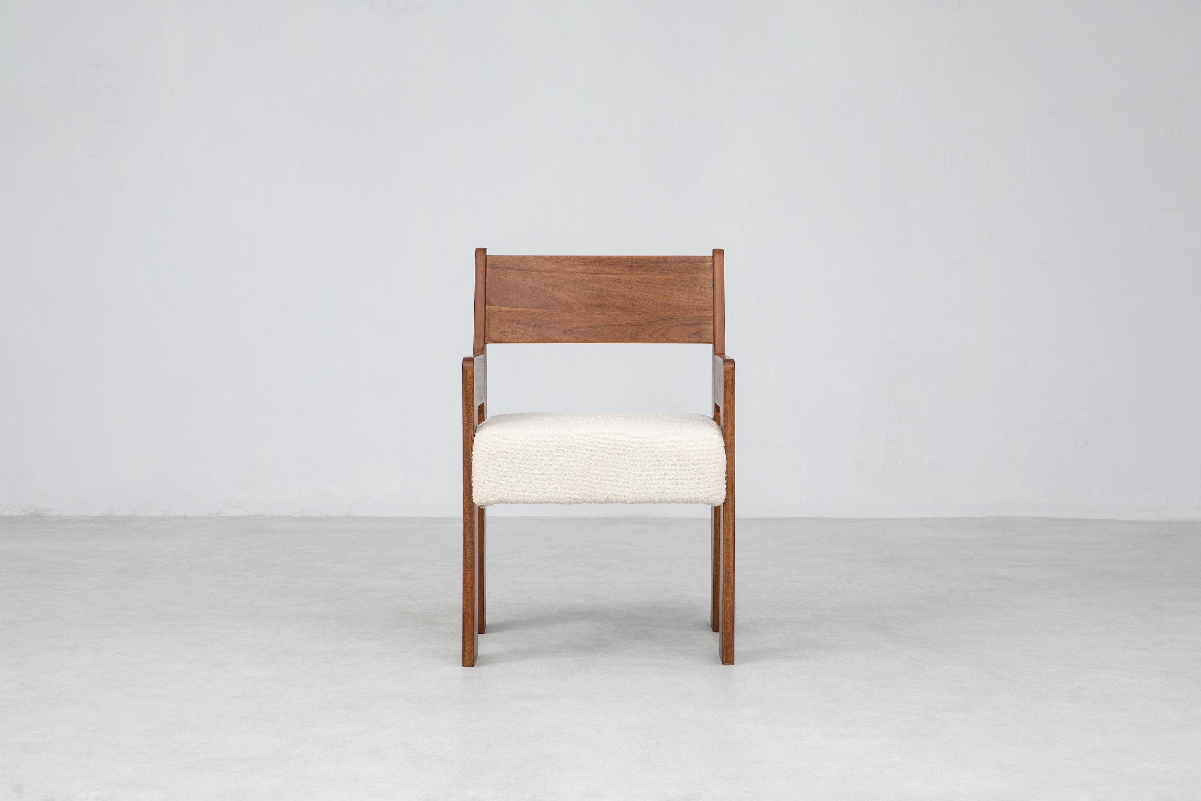 The Reka Armchair spotlights contrasting width. In designing the chair, we played with wide and narrow, thick and thin: the legs are wide and flat along one axis, thin along the other, while the seat cushion was elongated and fattened vertically. We