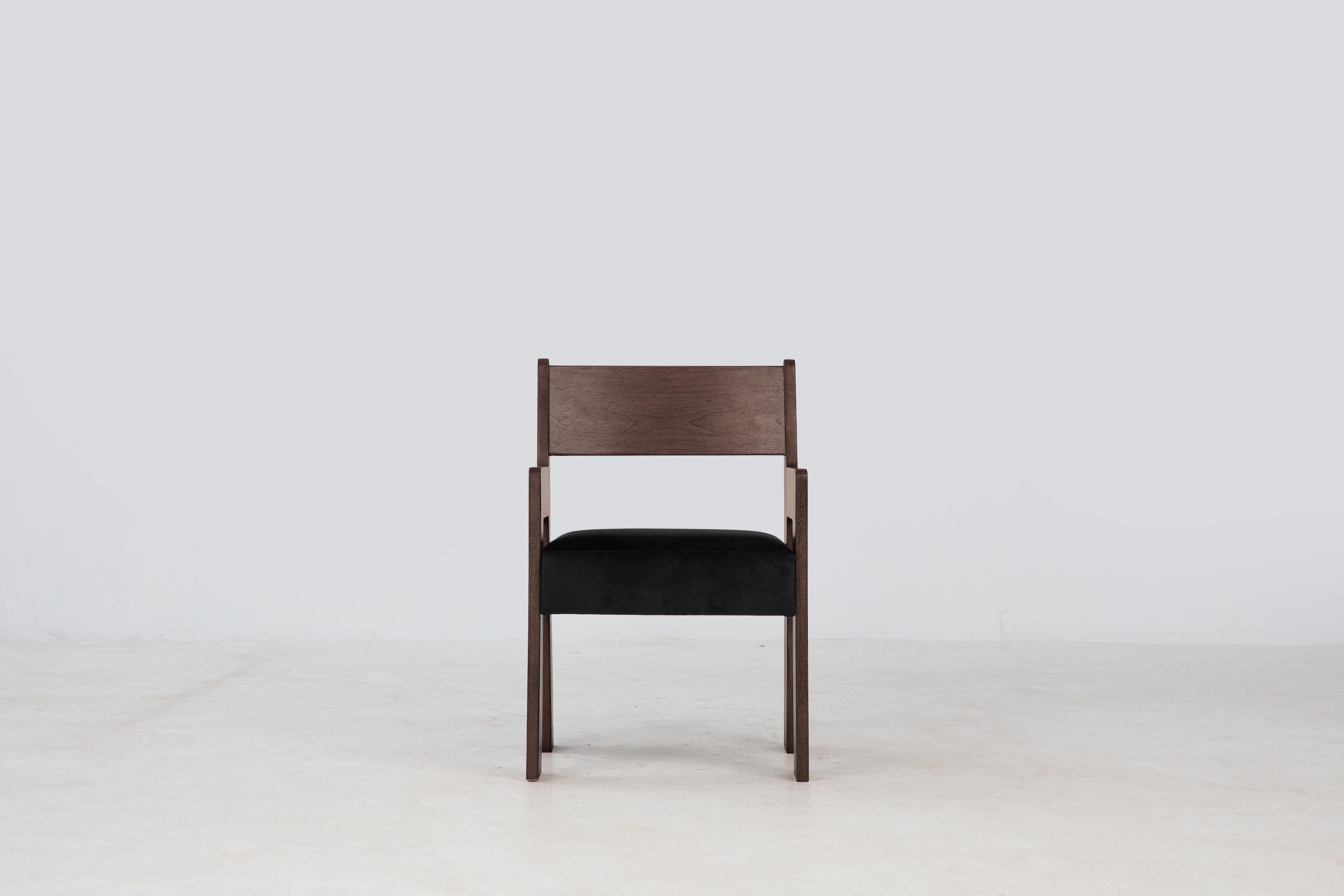 The Reka Armchair spotlights contrasting width. In designing the chair, we played with wide and narrow, thick and thin: the legs are wide and flat along one axis, thin along the other, while the seat cushion was elongated and fattened vertically. We