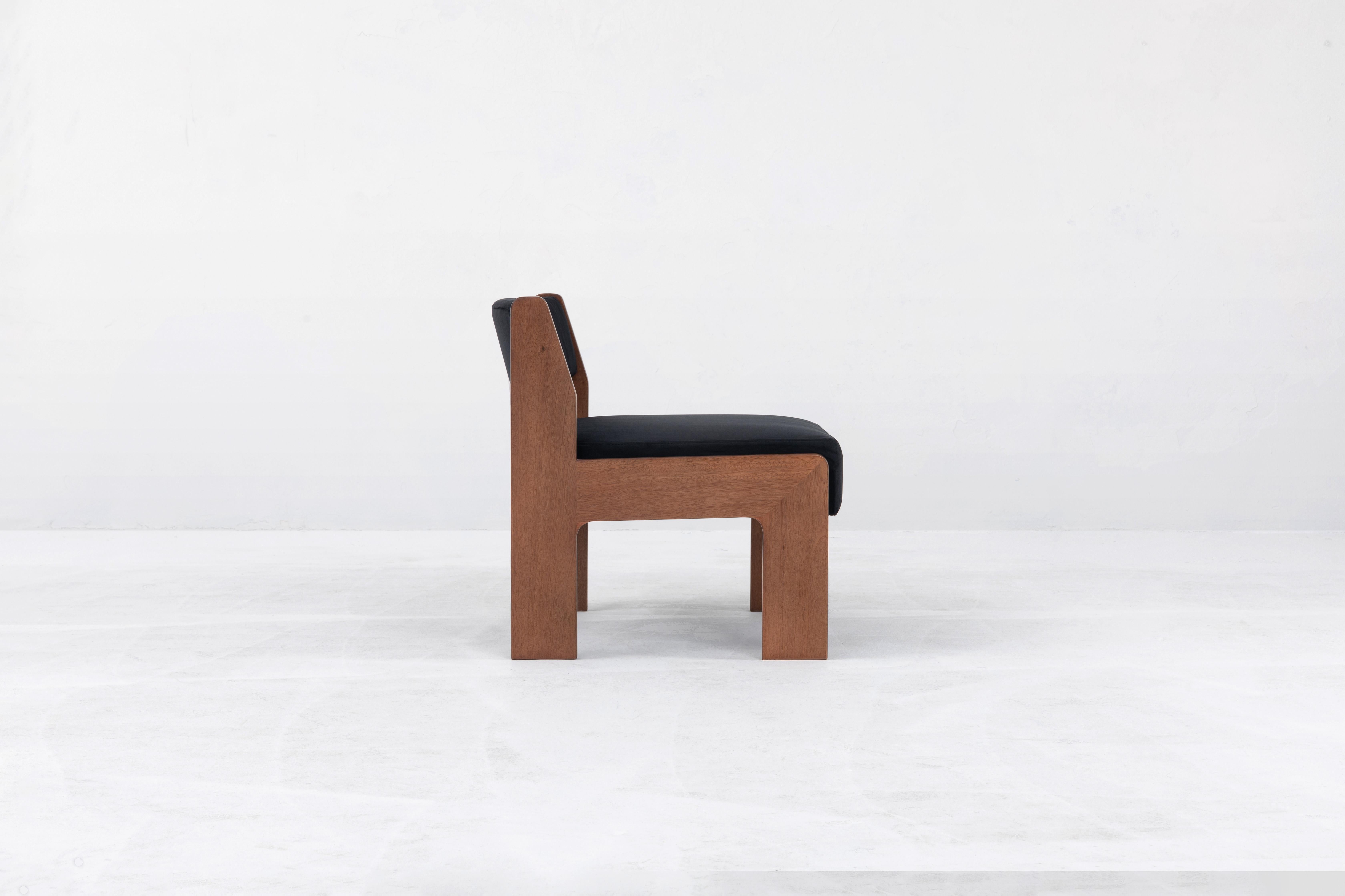 The lounge chair version of the Reka Chair, spotlighting contrasting width. In designing the chair, we played with wide and narrow, thick and thin: the legs are wide and flat along one axis, thin along the other, while the seat cushion was elongated