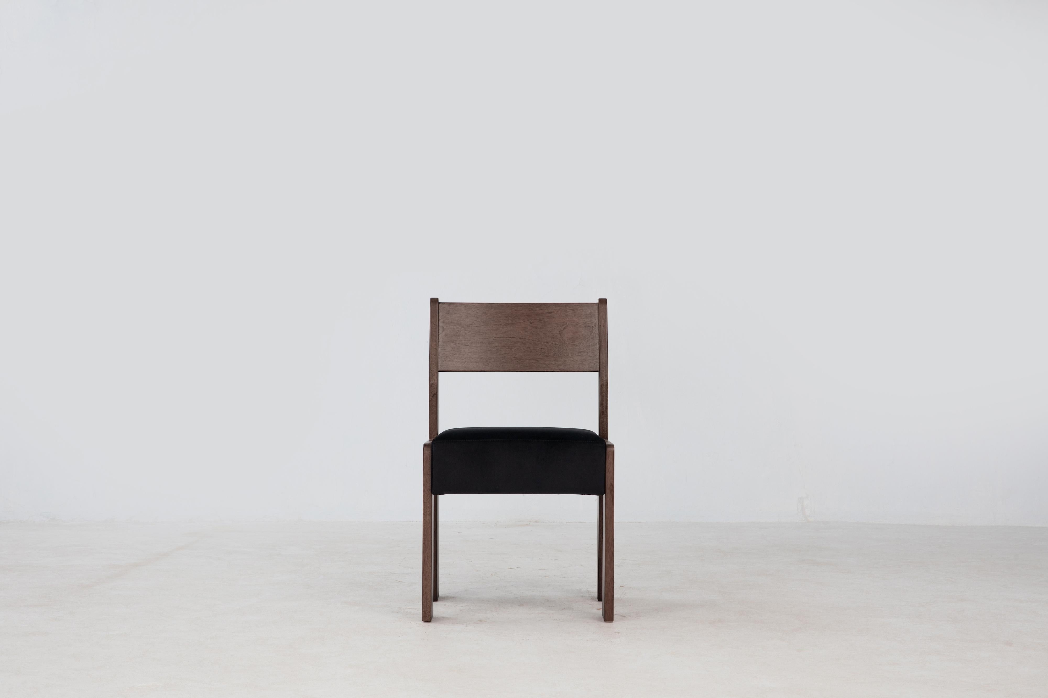 The Reka Side Chair spotlights contrasting width. In designing the chair, we played with wide and narrow, thick and thin: the legs are wide and flat along one axis, thin along the other, while the seat cushion was elongated and fattened vertically.