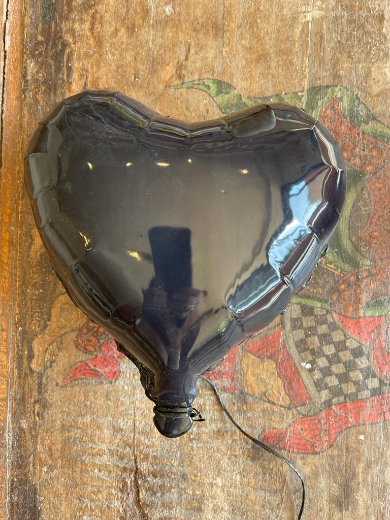 Black glossy ceramic heart balloon sculpture handmade for wall installation