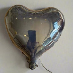 Black glossy ceramic heart balloon sculpture handmade for wall installation