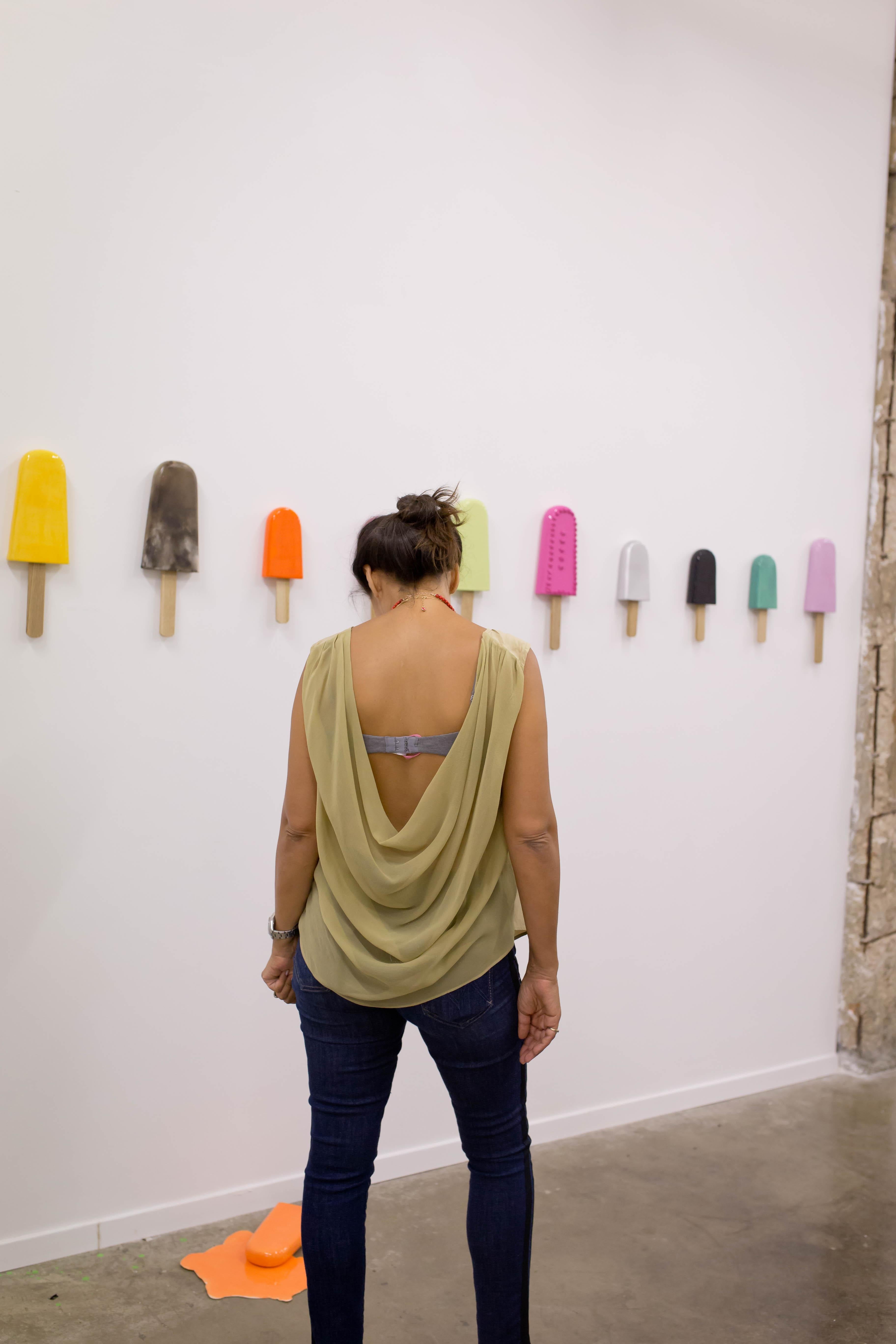 12 Glossy ceramic popsicles sculptures on a natural wood base. 
Color Numbers:
 SC- 85
SC- 9
SC-15
SC- 93
SC-18
SC-75
SC-24 
SC-73
SC-1
SC-2
SC-23
SC-13
Handmade by artists Osnat Zimerman and Reli Smith for wall installation. Available at Variant