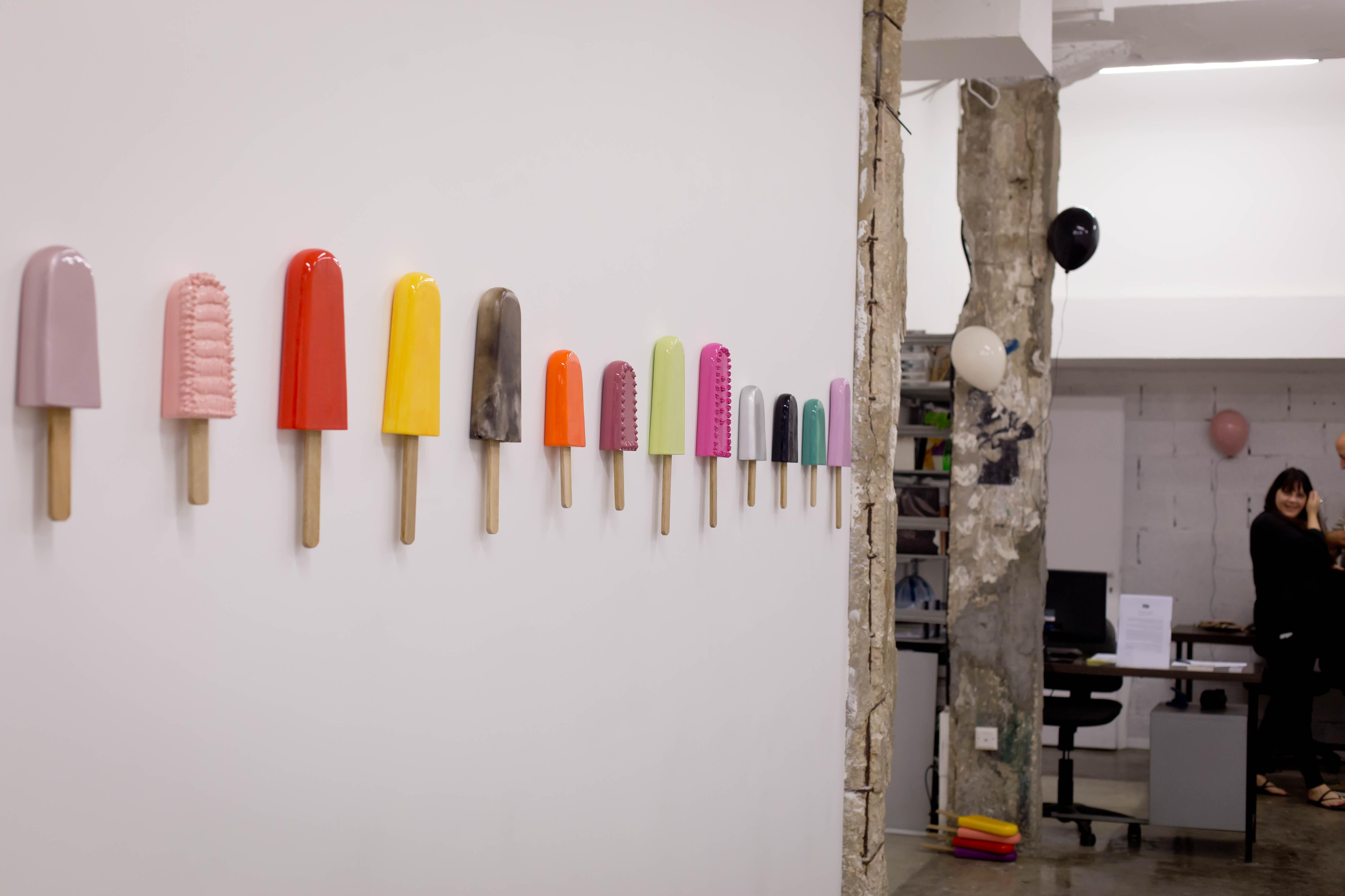 Reli Smith and Osnat Yaffe Zimmerman Figurative Sculpture - set of 13 popsicles wall installation - 6 big popsicles and 7 small popsicles