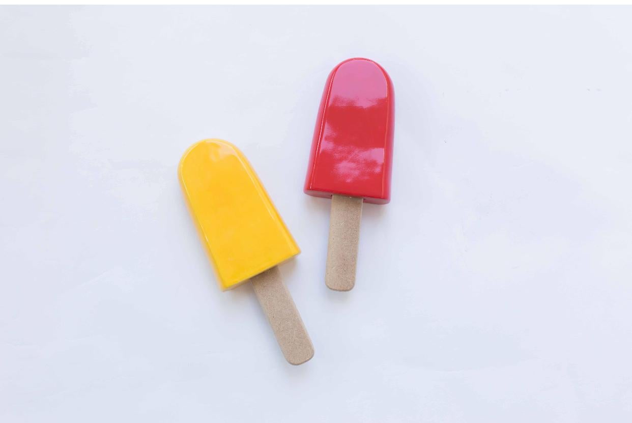 Glossy ceramic popsicle sculpture handmade for wall installation. Available at Variant colorful glaze.

Harmony and grandeur characterize the work of Reli Smith and Osnat Yaffe Zimmerman in their artistic cooperation under the brand R+O Design. The