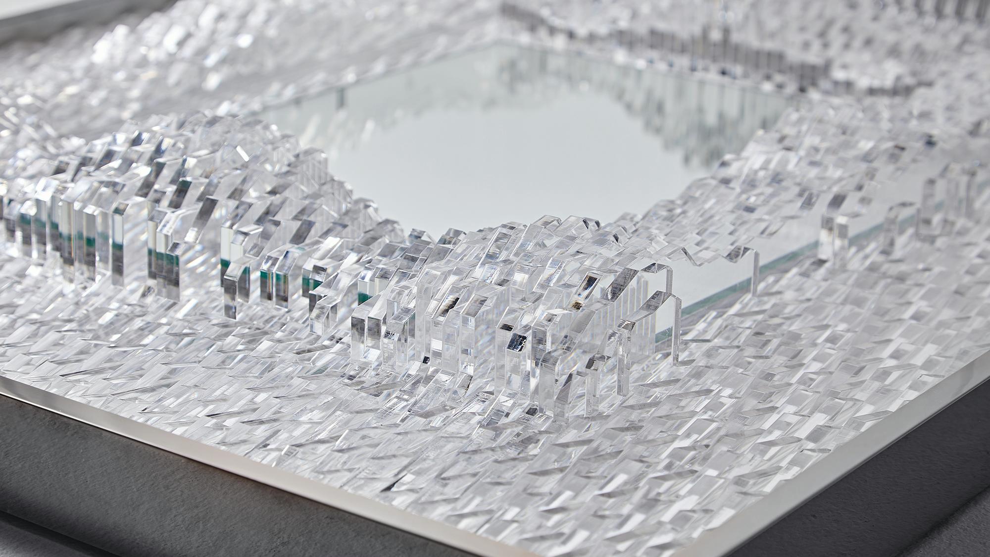 This sculptural mirror brings Baroque relief into a contemporary design language. From the front, it appears minimal and architectural, yet as light or the viewer’s position shifts, fluid Baroque curves subtly emerge like an optical illusion.

Each