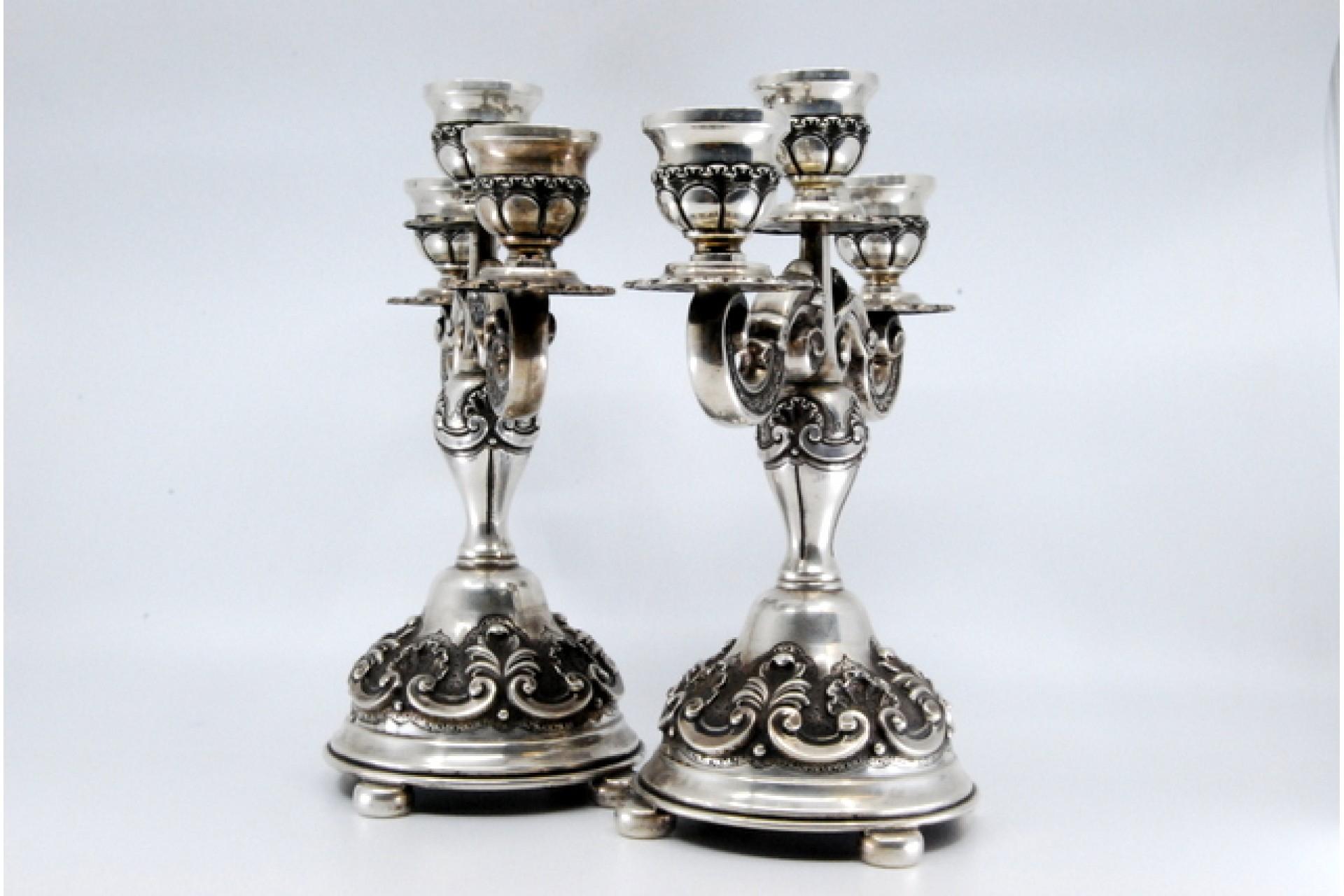 European Relief silver candelabra with shells, three lights and circular bases with feet For Sale