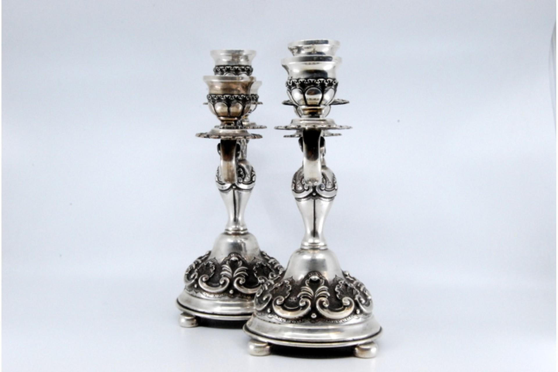 20th Century Relief silver candelabra with shells, three lights and circular bases with feet For Sale