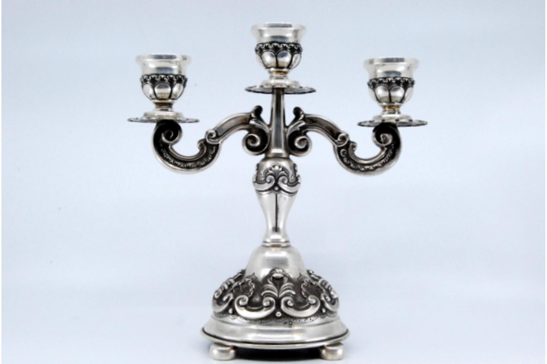 Silver Relief silver candelabra with shells, three lights and circular bases with feet For Sale