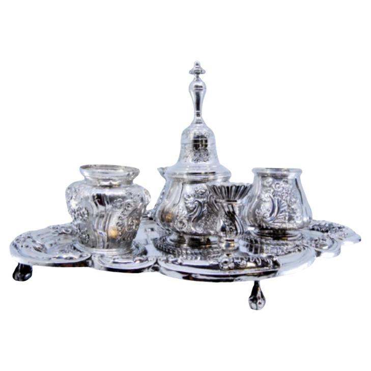 Relief silver inkwell with tanks, bell 
four claw-shaped feet